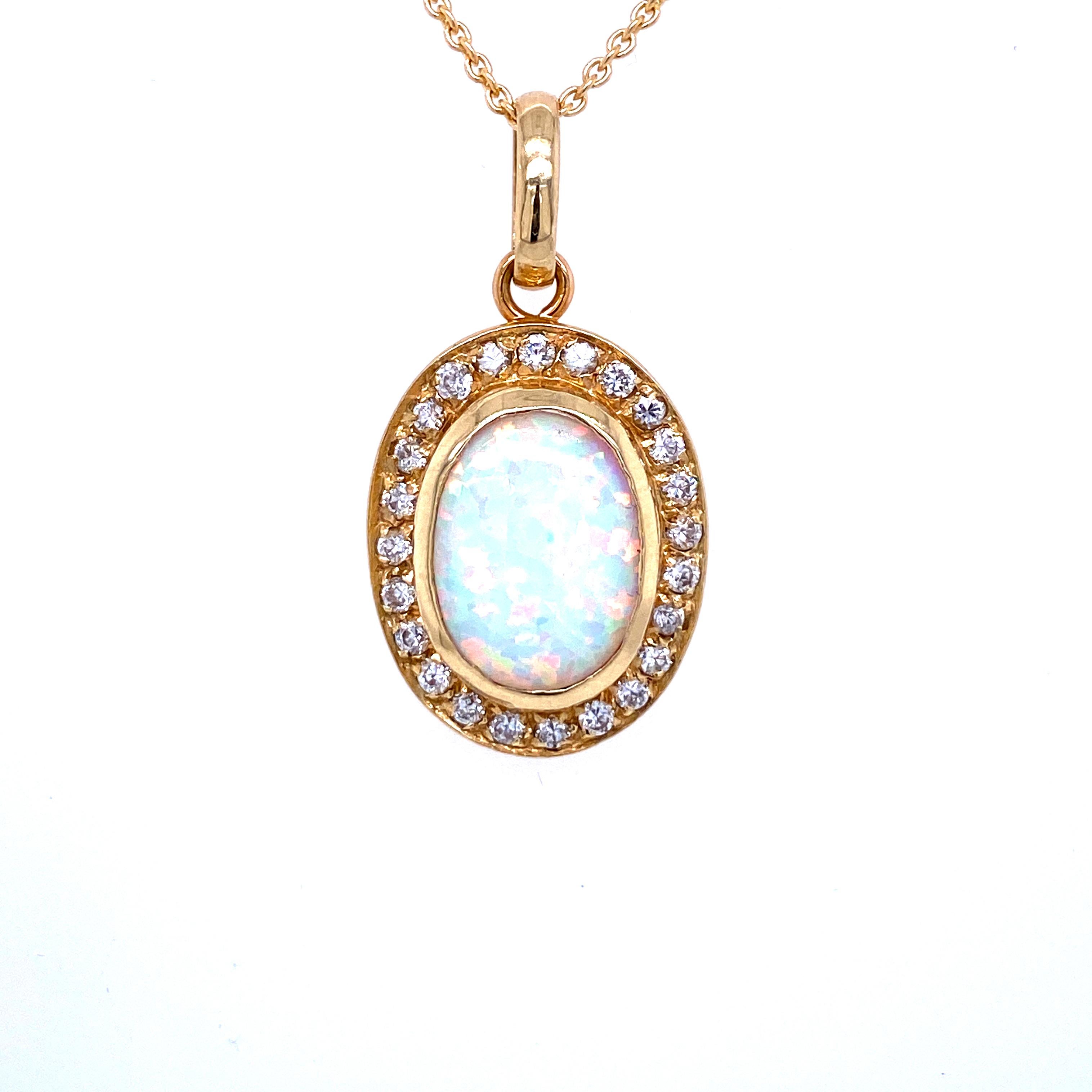 A classy vintage piece features in the middle a wonderful Natural Ethiopian Opal weighing 2 carats surrounded by Sparkling Round brilliant cut Diamonds for a total weight of 0.50 carat G color Vvs1 clarity. The pendant is set in a 18k yellow gold,