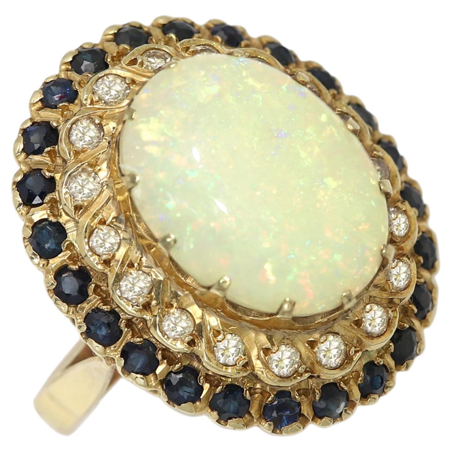 Vintage Opal Ring Circa 1940's 14k Yellow Gold Blue Sapphire and Diamonds For Sale