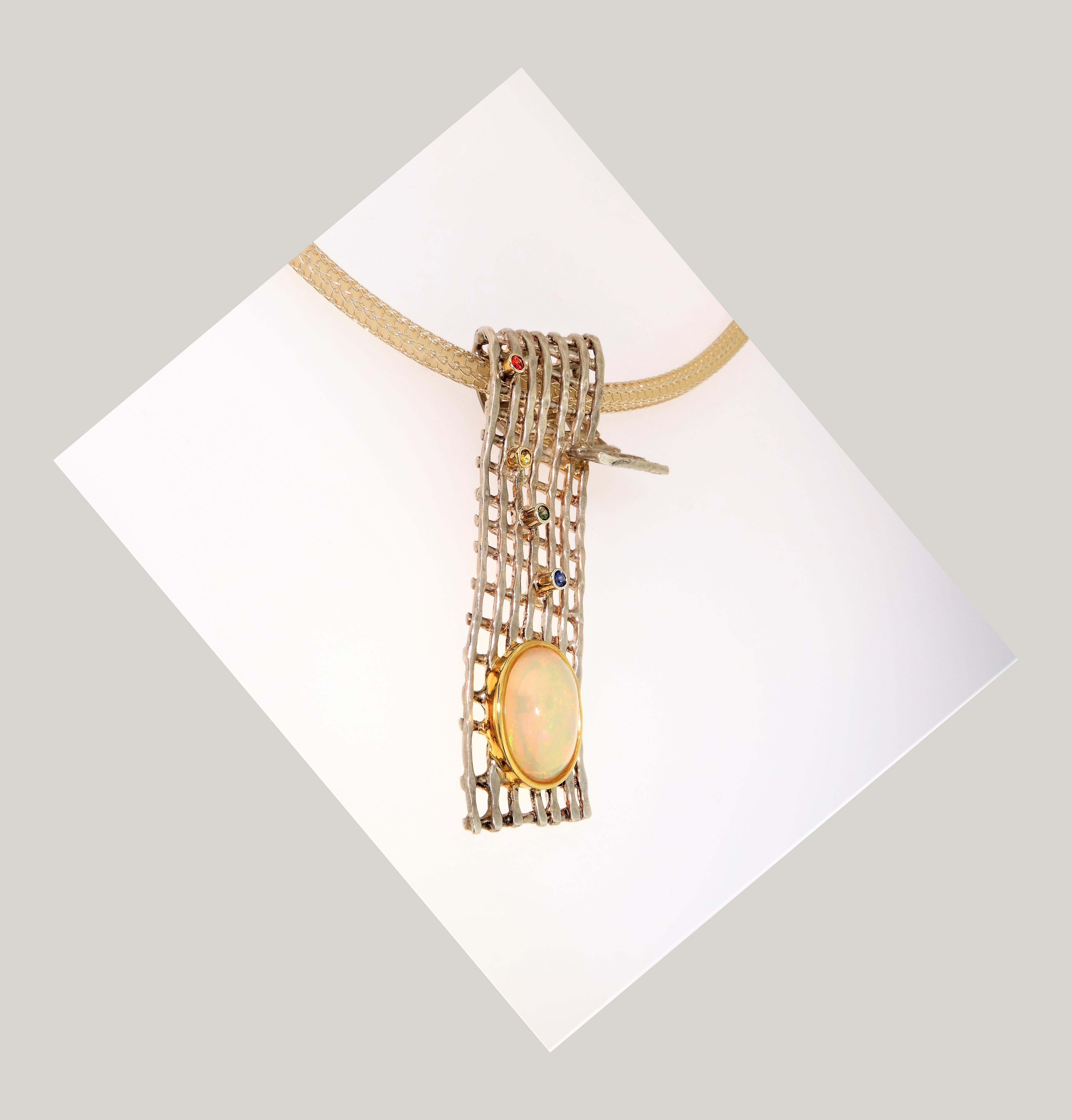 Stylish and finely detailed Ethiopian Opal and Gemstone Sapphire Pendant Necklace in flattering Lattice rectangular form; Opal Stone Weighs approx. 3.65 Carat; approx. stone size: 14 x 11mm; Diamond cut Round Sapphire stone weights approx. 0.13