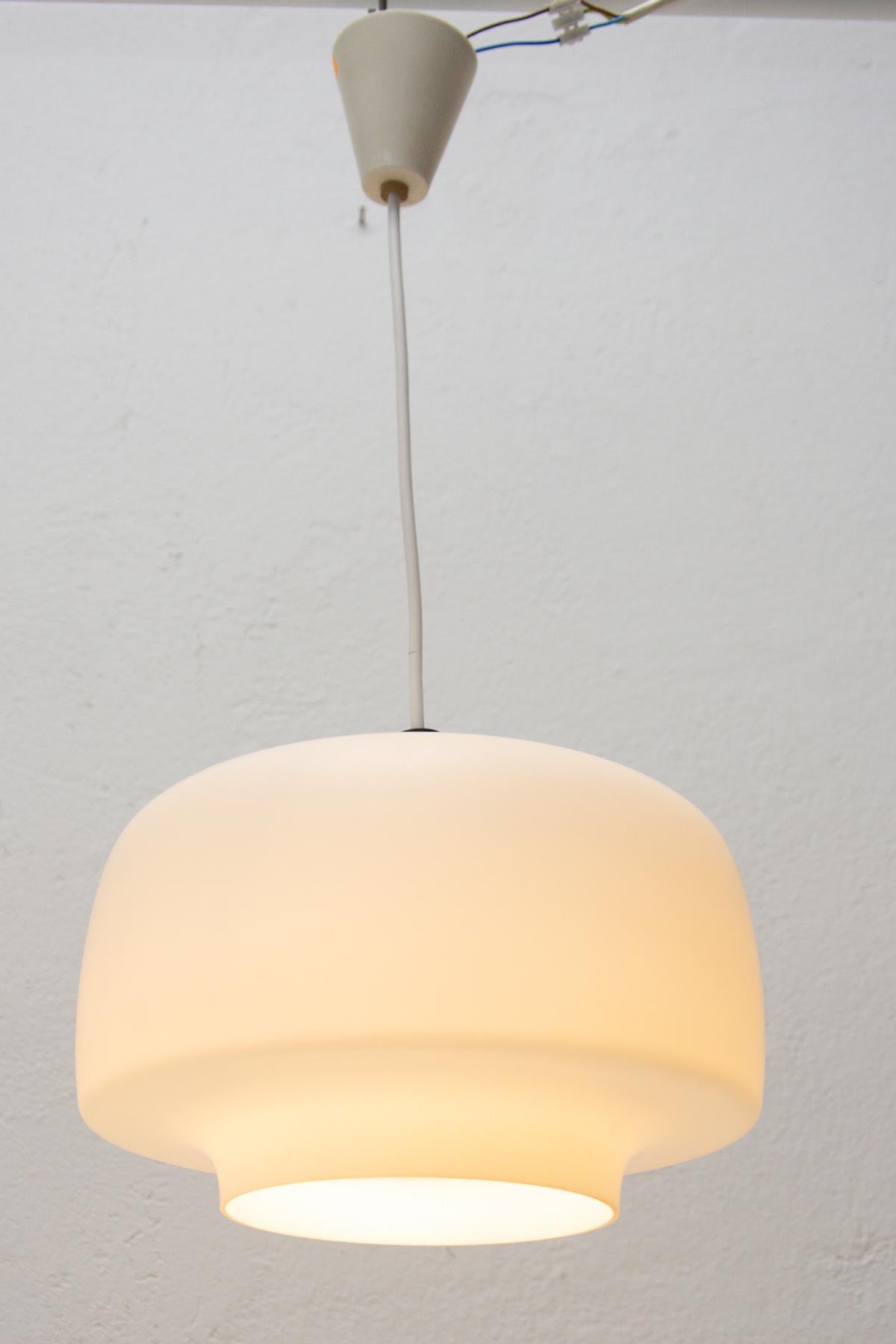 Modernist pendant chandelier made of white opal glass, Czechoslovakia, 1970´s. Suitable for entrance hall, living rooms or office.
In very good vintage condition. Newly wired.

Lampshade height: 17 cm.