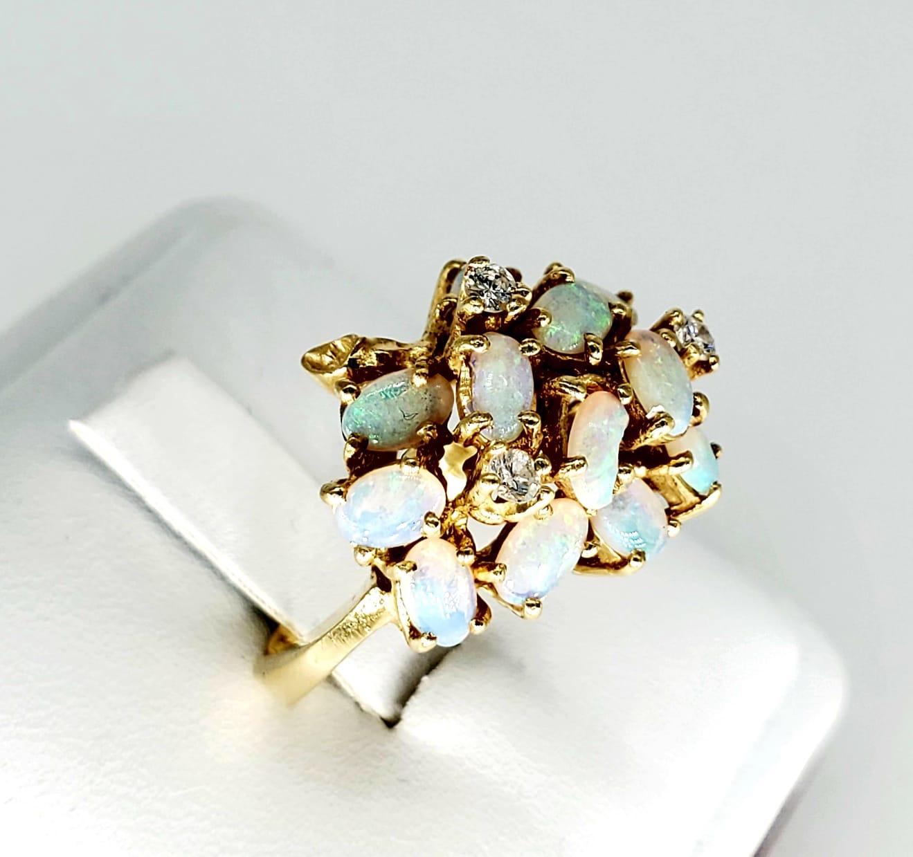 Vintage Opal & Diamond 14k Gold Cluster Ring. Stunning decorative design by this maker. This ring features approx 2.85 carat of opal gemstones and approx 0.15 carat of white diamonds featured in the center. The ring weights 7.5 grams and is a size 7.