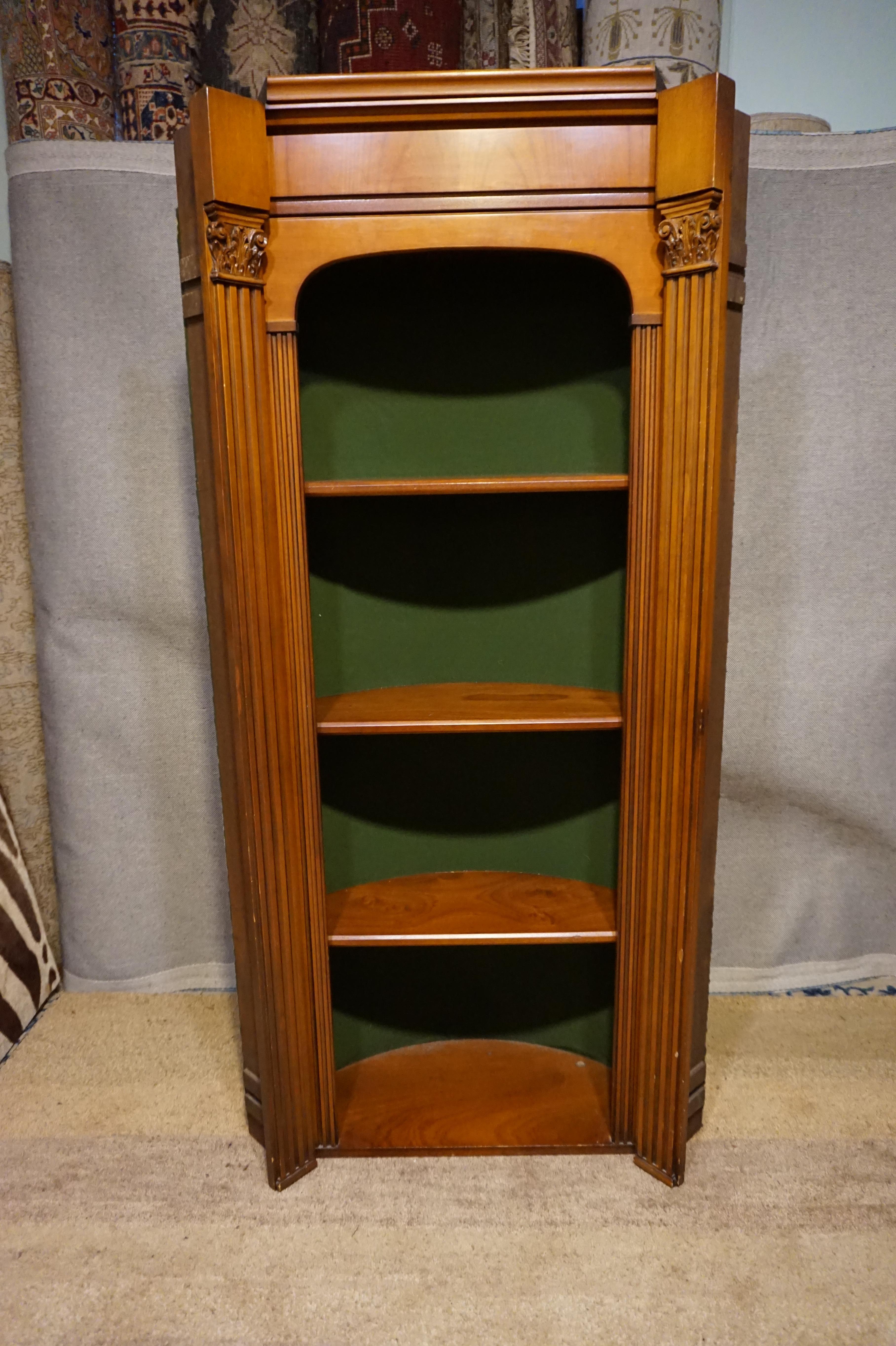 High end vintage corner cabinet built along the neoclassical style with fluted edges. Excellent for a built in project. Ideal for books and display and exuding warmth and finesse.