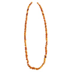 Collier de perles d'ambre orange vintage, 1960