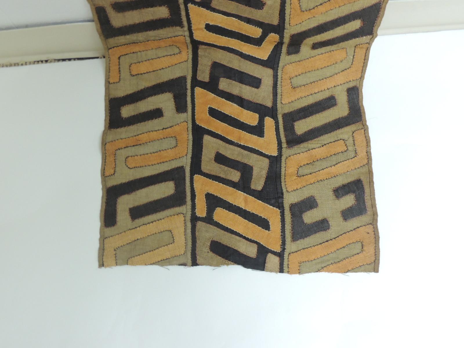 Vintage orange and black African Kuba Applique textile. Long textiles woven tribal pattern in shades of orange, grey and black.
Accentuated with orange overlapped stitches.
The word “Kuba” means “lighting” referring to the blades that were once