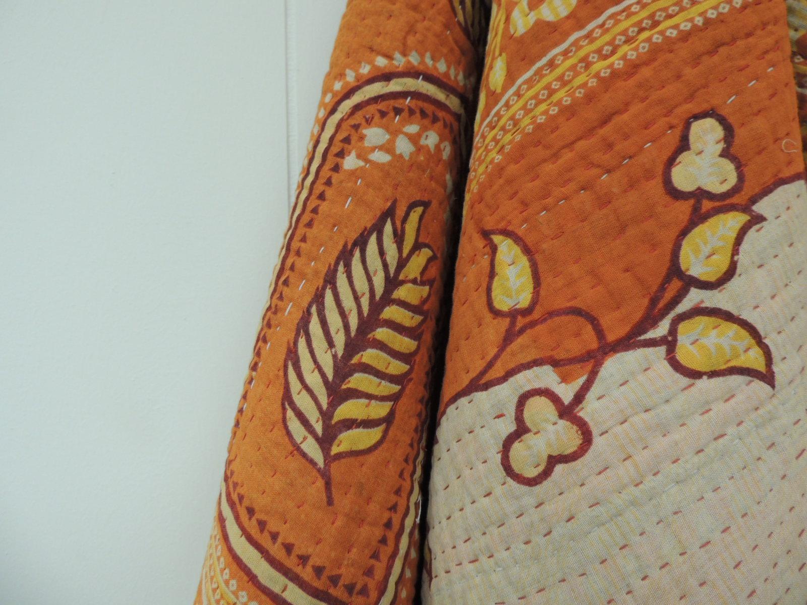 Vintage orange and red Indian quilted cloth/throw with white and red hand stitched details and artisanal patchwork design.
Lining is pieces of cotton stitch together. Floral design in shades of orange, red, yellow, and white.
Size: 53.5 x