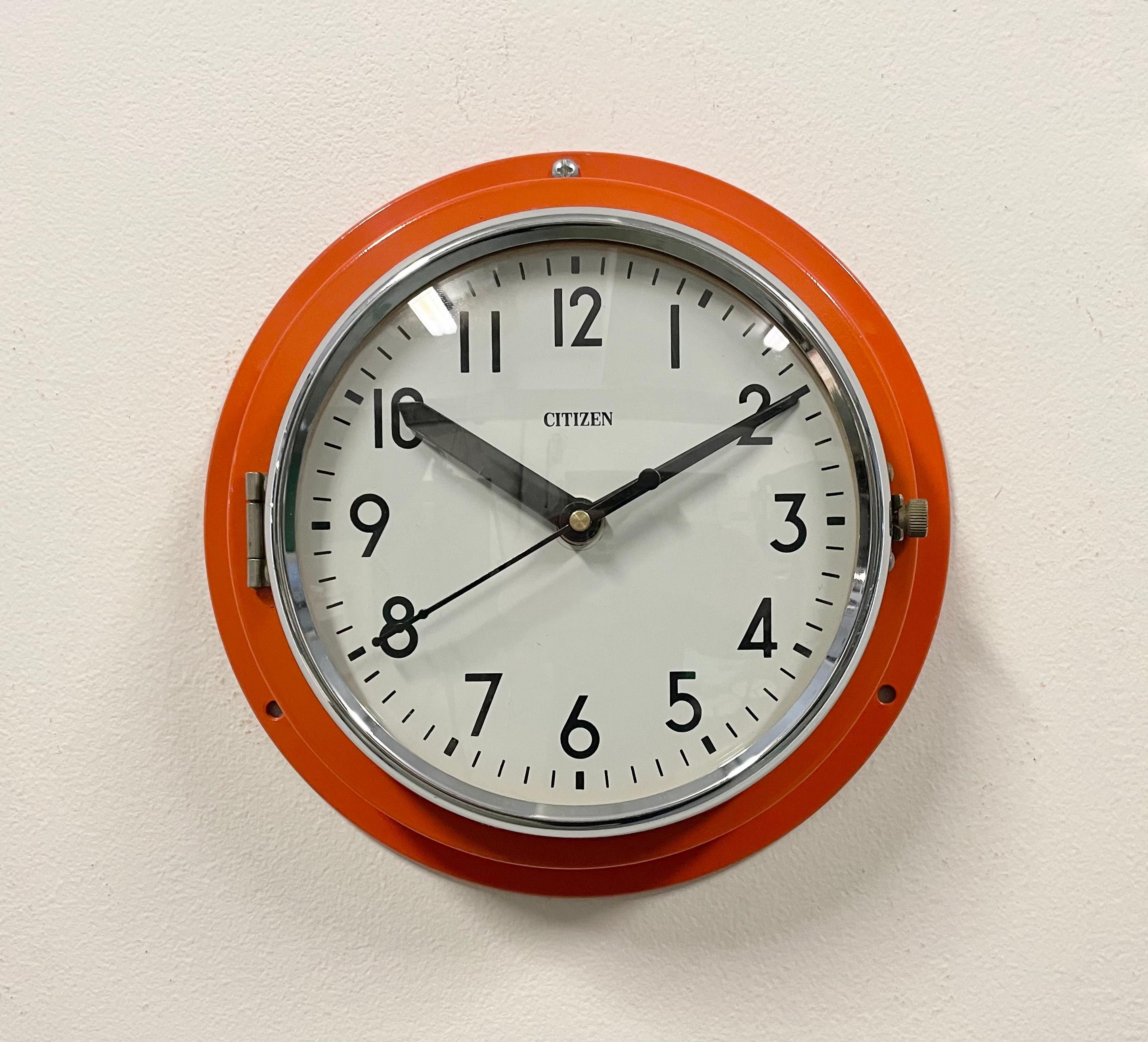 Vintage citizen navy slave clock designed during the 1970s and produced till 1990s. These clocks were used on large Japanese tankers and cargo ships. It features a orange metal frame, a plastic dial and curved clear glass cover. This item has been