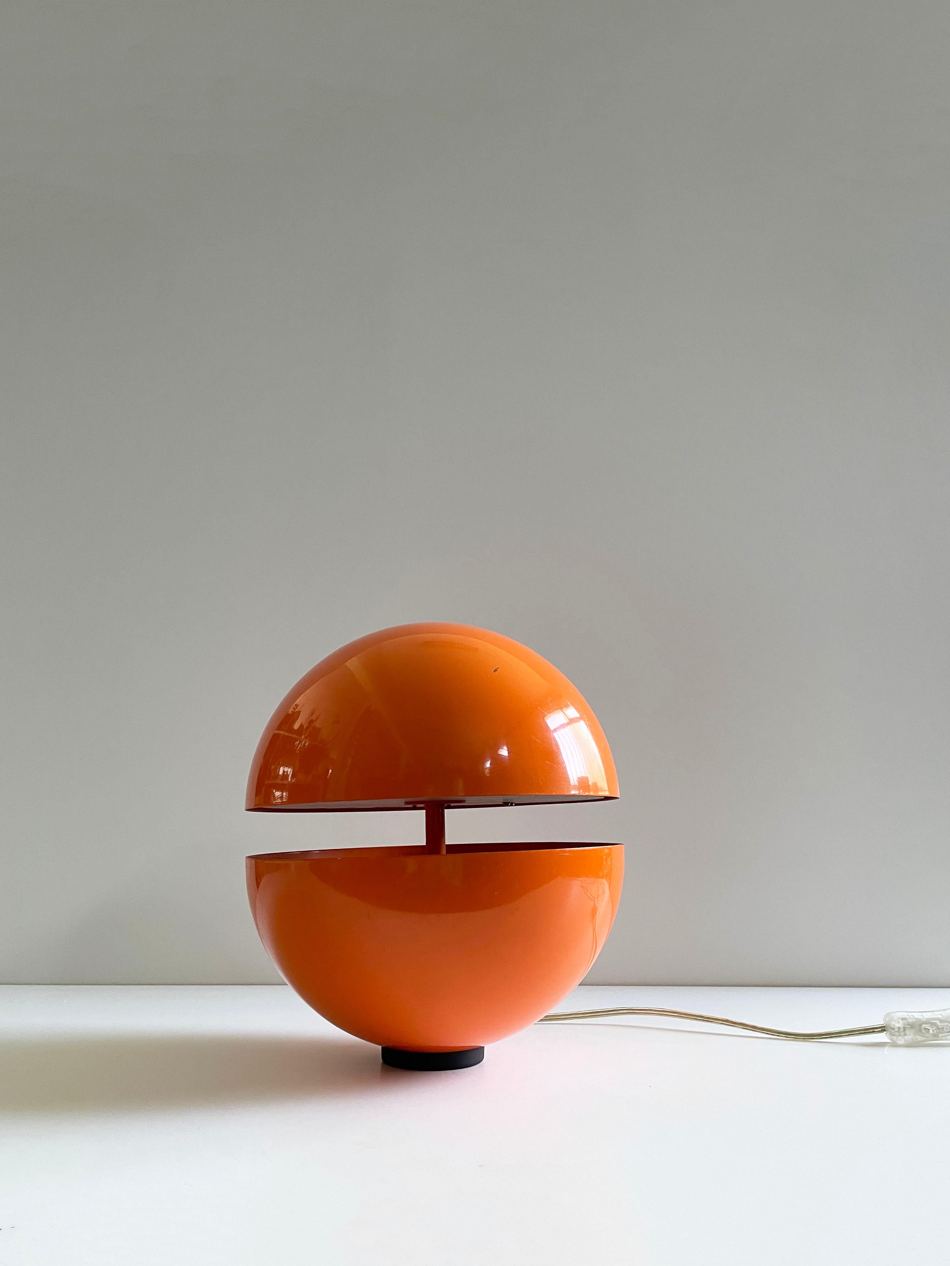 Vintage globe-shaped lamp designed by Andrea Modica and produced by Lumes, Switzerland 1980s 1990s

The lamp is stamped, it has an on/off switch, the metal made globe is lacquered in vibrant orange colour. Inside the lamp is a brushed glass disc