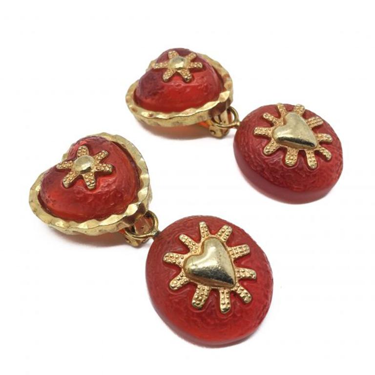 Fabulous Vintage 1990s Orange Heart Earrings. Featuring stippled burnt orange resin with 18ct gold plated motifs and surrounds. Clip on earrings, in very good vintage condition, measuring 5.5cm. Great quality and style - a fab earring for a one of a