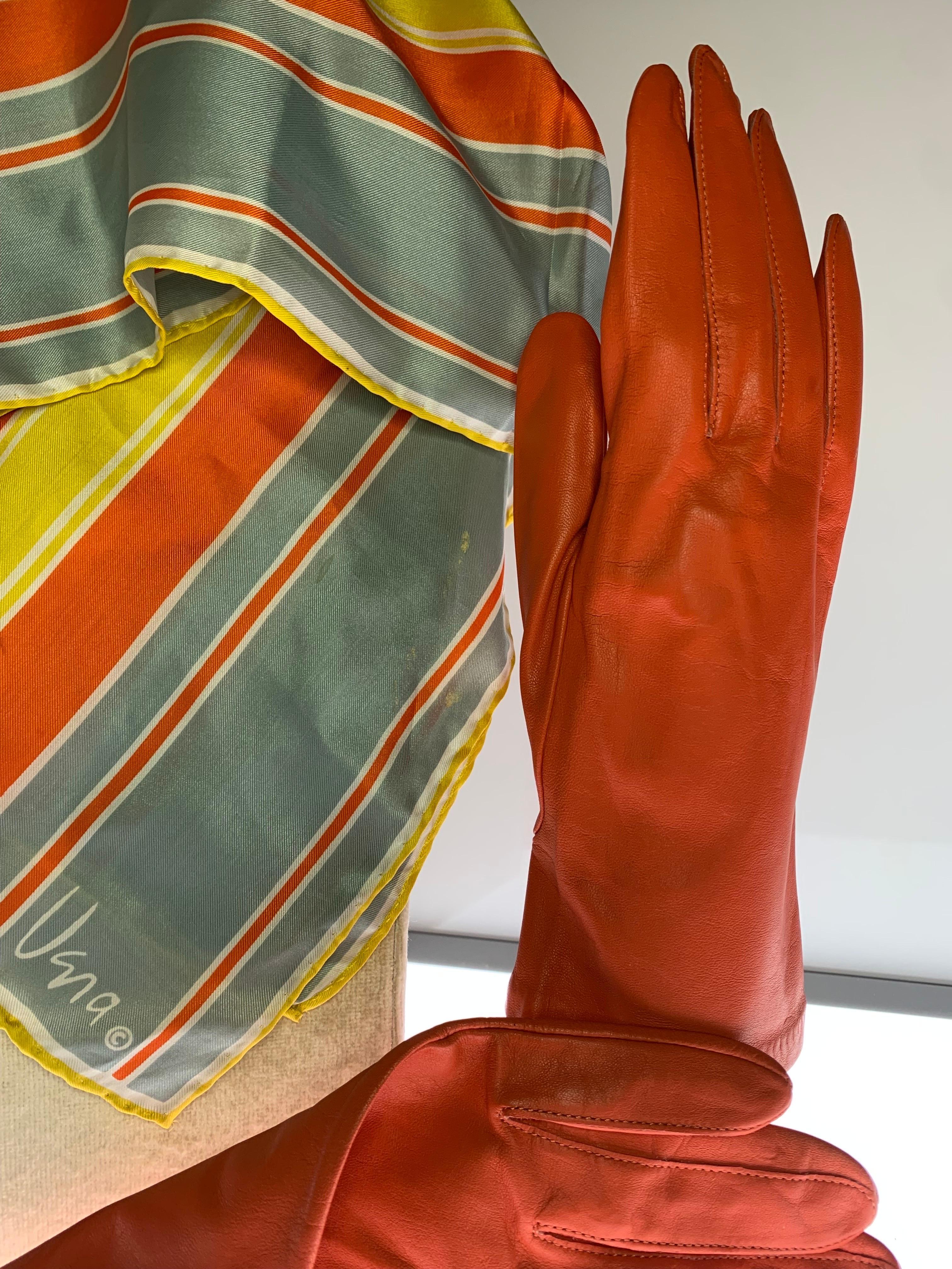 Vintage Orange Leather Gloves & Coordinating Graphic Print Vera Silk Scarf Set:  1980s Grandoe kid leather gloves, unlined in a size 8 and an orange, yellow and slate color striped silk Vera scarf to match. Sold as a set. 