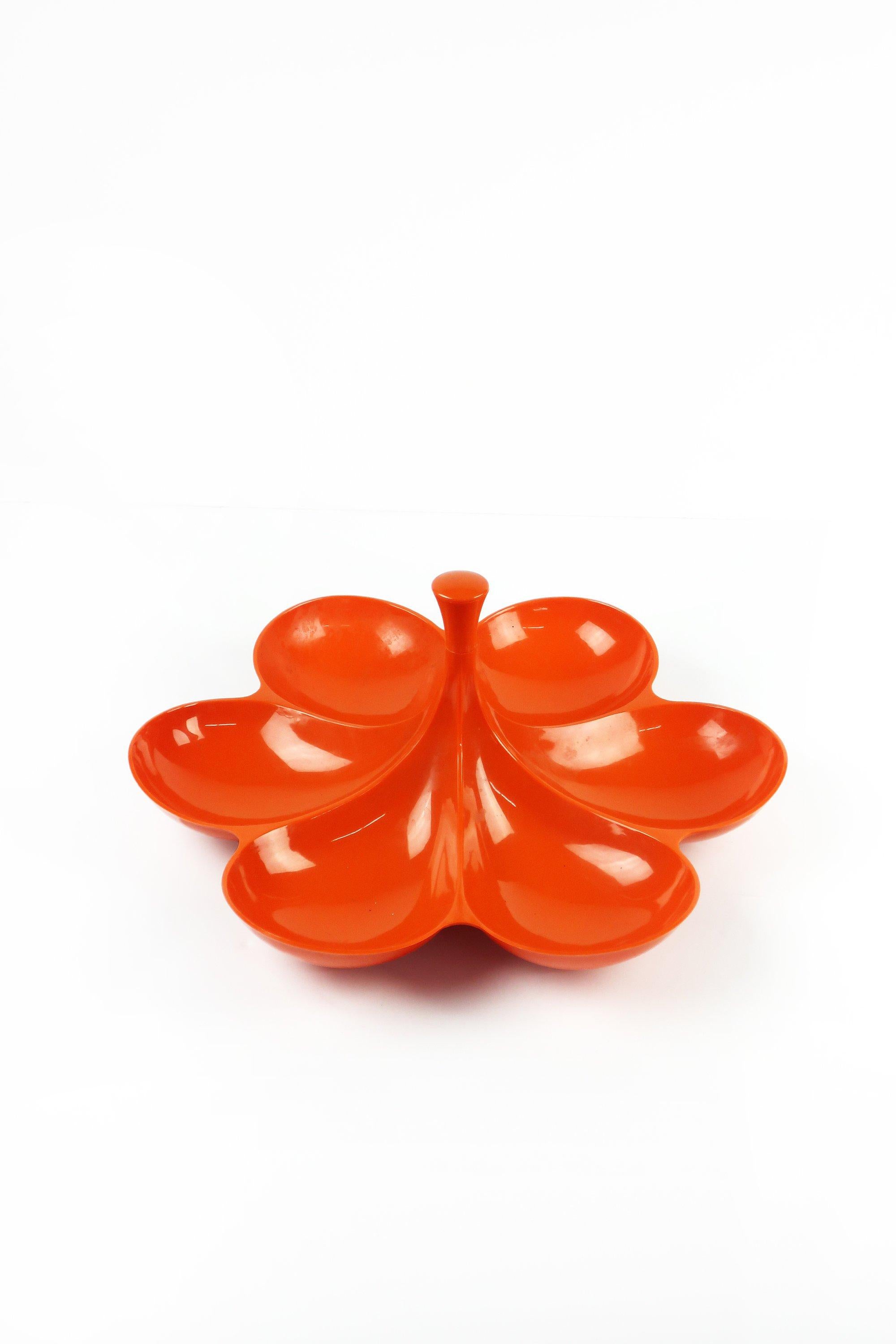 A beautiful Mid-Century Modern orange flower-shaped snack server with bullt-in Lazy Susan built in the base. The perfect addition to any MCM, Mod, or Contemporary home, and it is fun to spin!
 
 Measures: 14” x 14” x 7”.