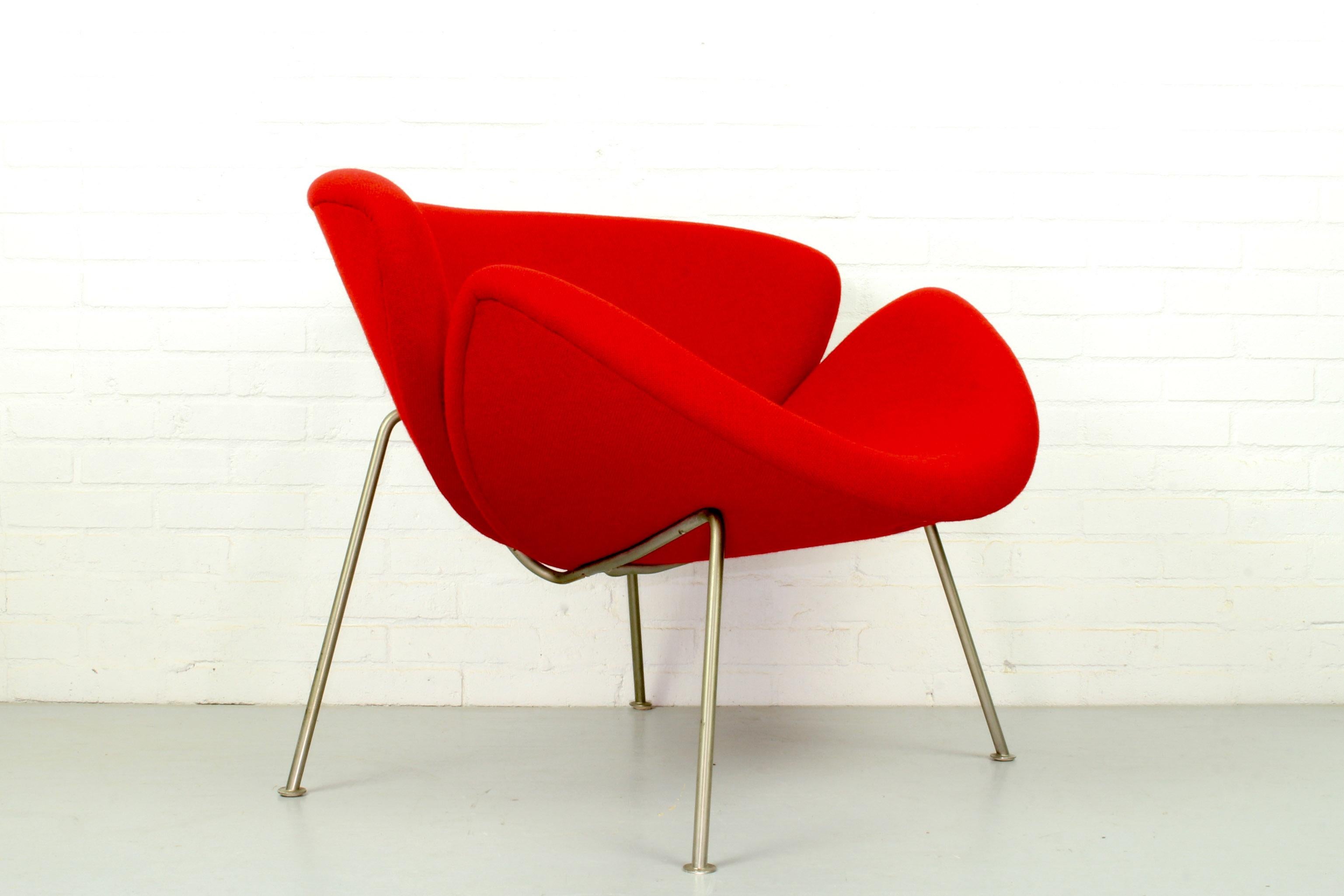 The famous orange slice chair by Pierre Paulin was designed in the 1960s. The fabric and the foam are in very good vintage condition, the chair is upholstered in a beautiful red color.