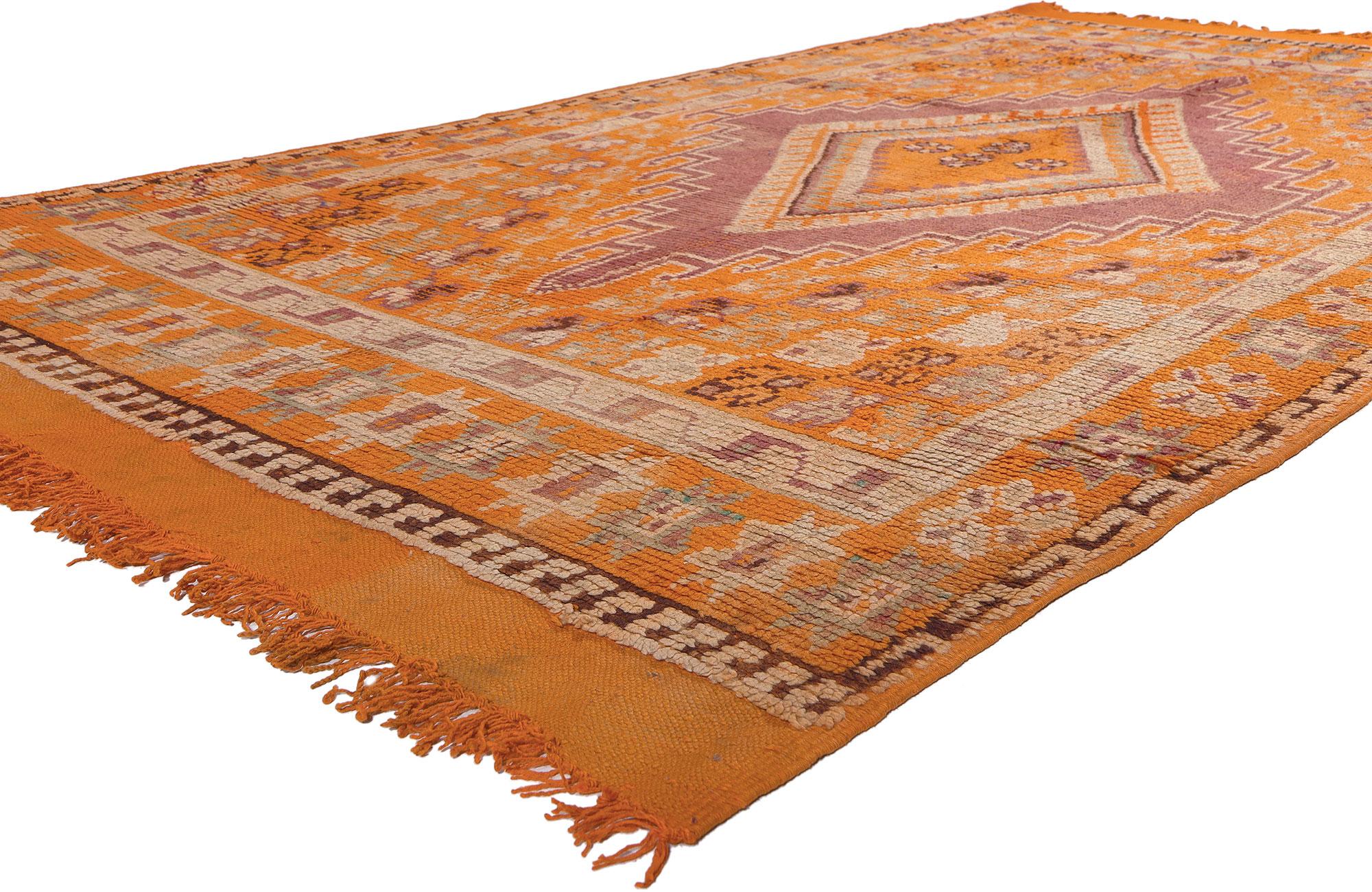 20229 Vintage Orange Taznakht Moroccan Rug, 05'07 x 09'10.
Dive into the cultural tapestry meticulously woven by the Taznakht Tribe, as they masterfully craft this hand-knotted wool vintage Berber Moroccan rug amidst the rugged terrain of the High