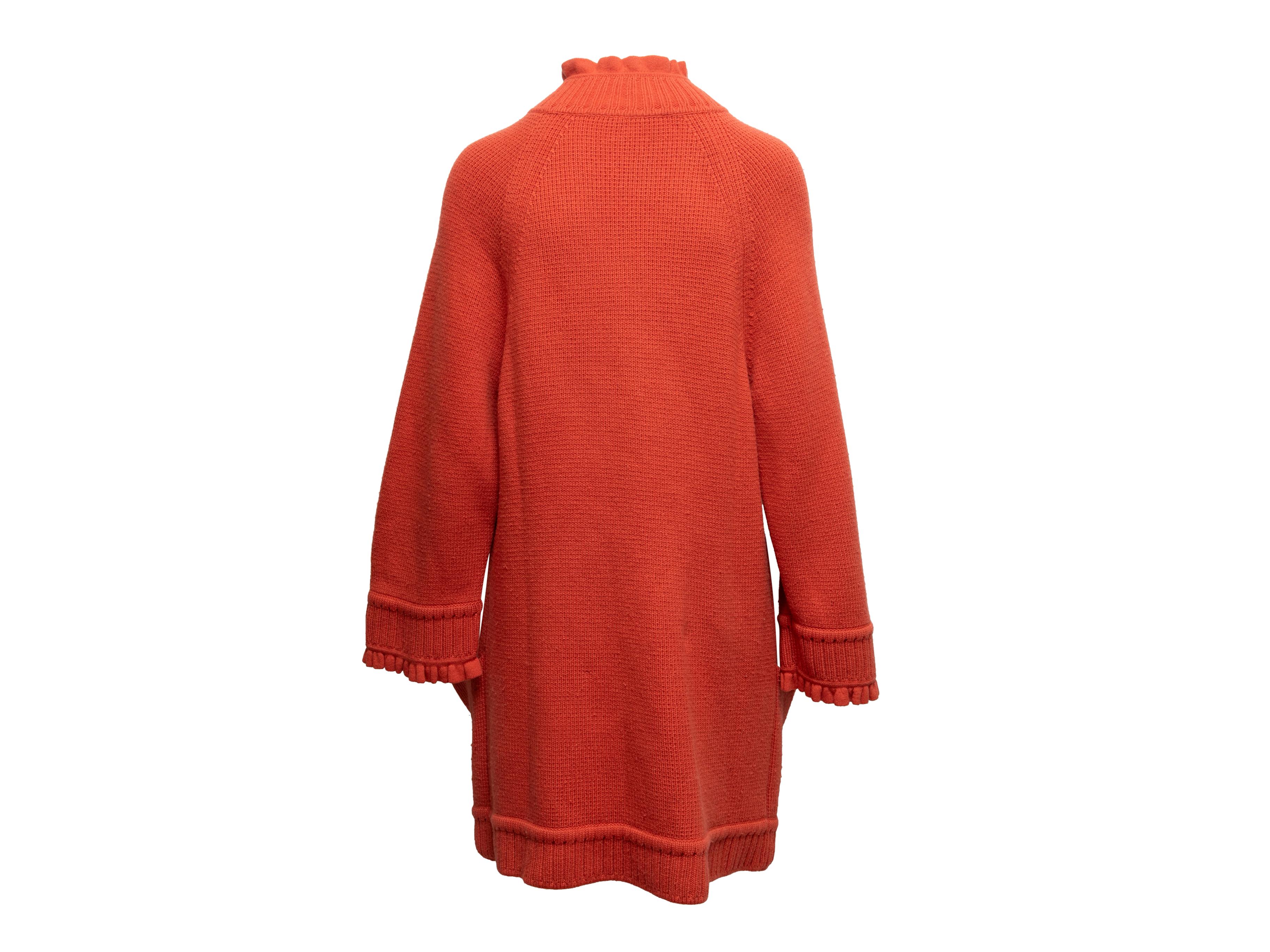 Vintage orange virgin wool and cashmere-blend longline cardigan by Valentino. Crew neck. Dual hip pockets. Button closures at center front. 32