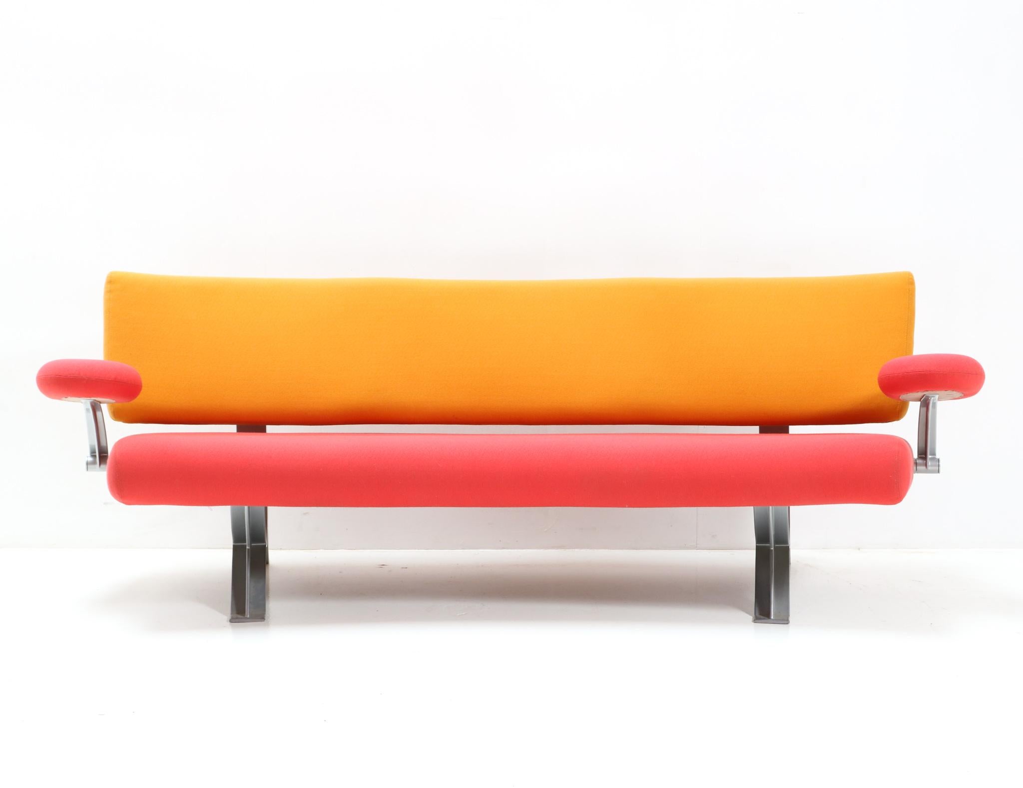 Stunning vintage sofa or bench.
Design by Wolfgang C.R. Mezger for Artifort.
Striking Dutch design from the 1990s.
Model Orbit C341/3
Original silver/grey lacquered aluminum frame with original two-tone upholstery in yellow and pink fabric.
Weight