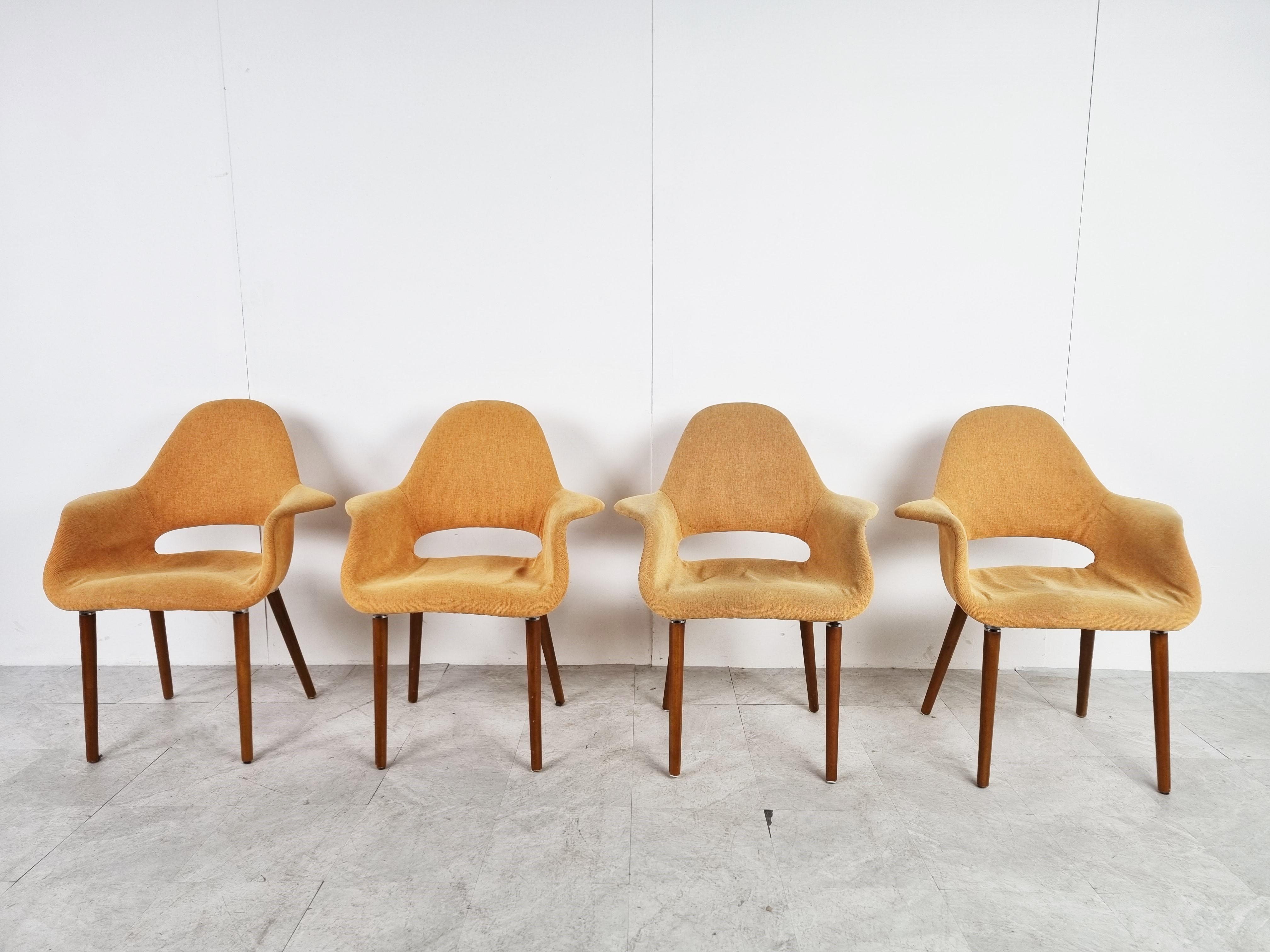 Elegant organic armchairs with yellow / orange upholstered shells on 4 wooden legs.

Good condition.

1970s

Dimensions:
Height: 88 cm / 34.64