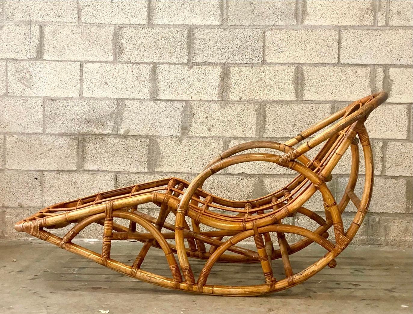 Incredible vintage Coastal bamboo rocking chair. Beautiful thick bamboo done in a chic boho design. An unusual and rare piece. Acquired from a Palm Beach estate.