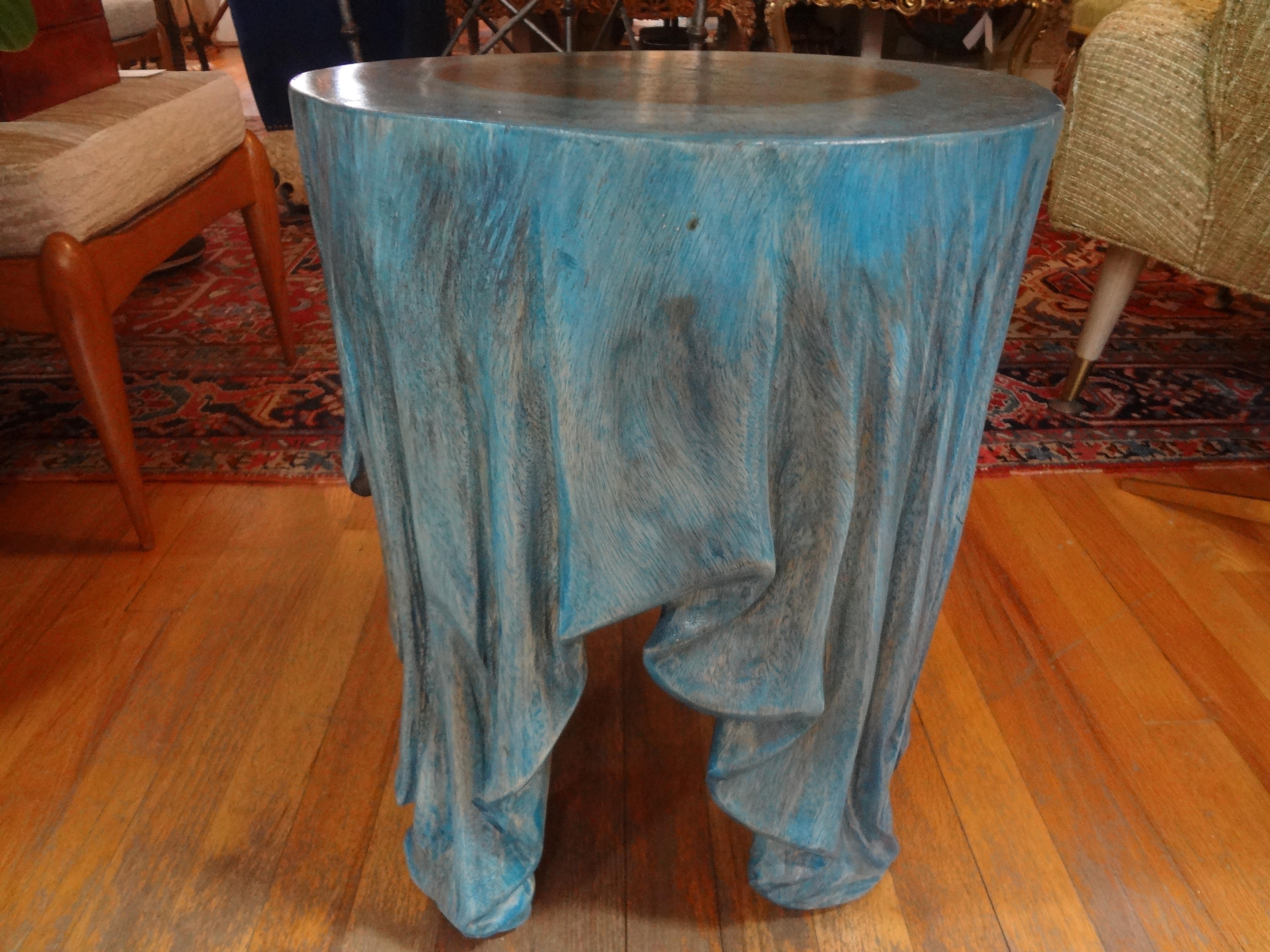Stunning organic modern carved wood draped table or bench. The unusual vintage carved wood draped table, side table, or drink table was carved from one-piece of wood and is stained a lovely shade of blue and is sturdy enough to be used as a bench,