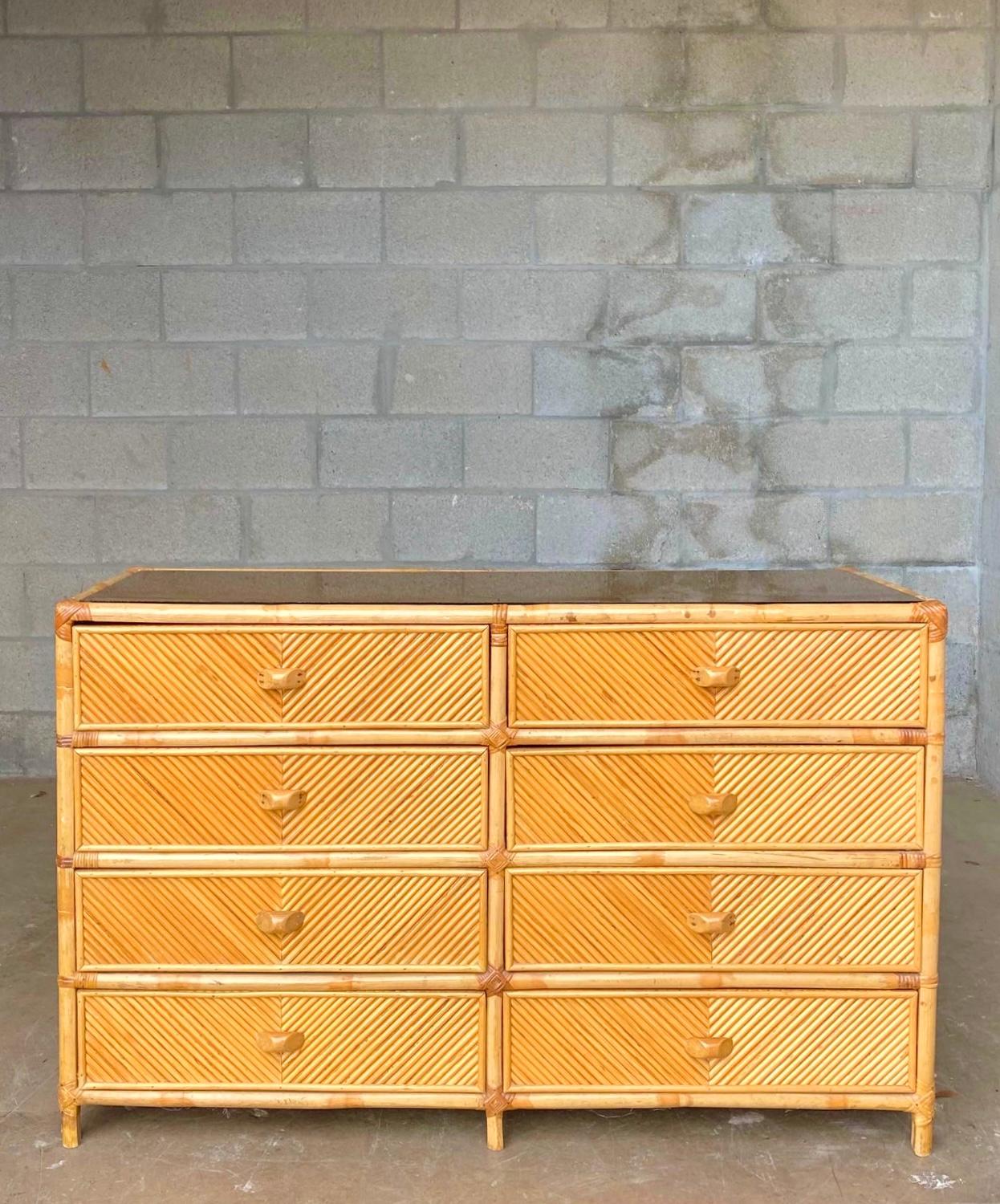 Fantastic vintage organic modern dresser. Beautiful natural pencil reed in a chevron design. Six drawers with a high profile. Acquired from a Palm Beach estate.