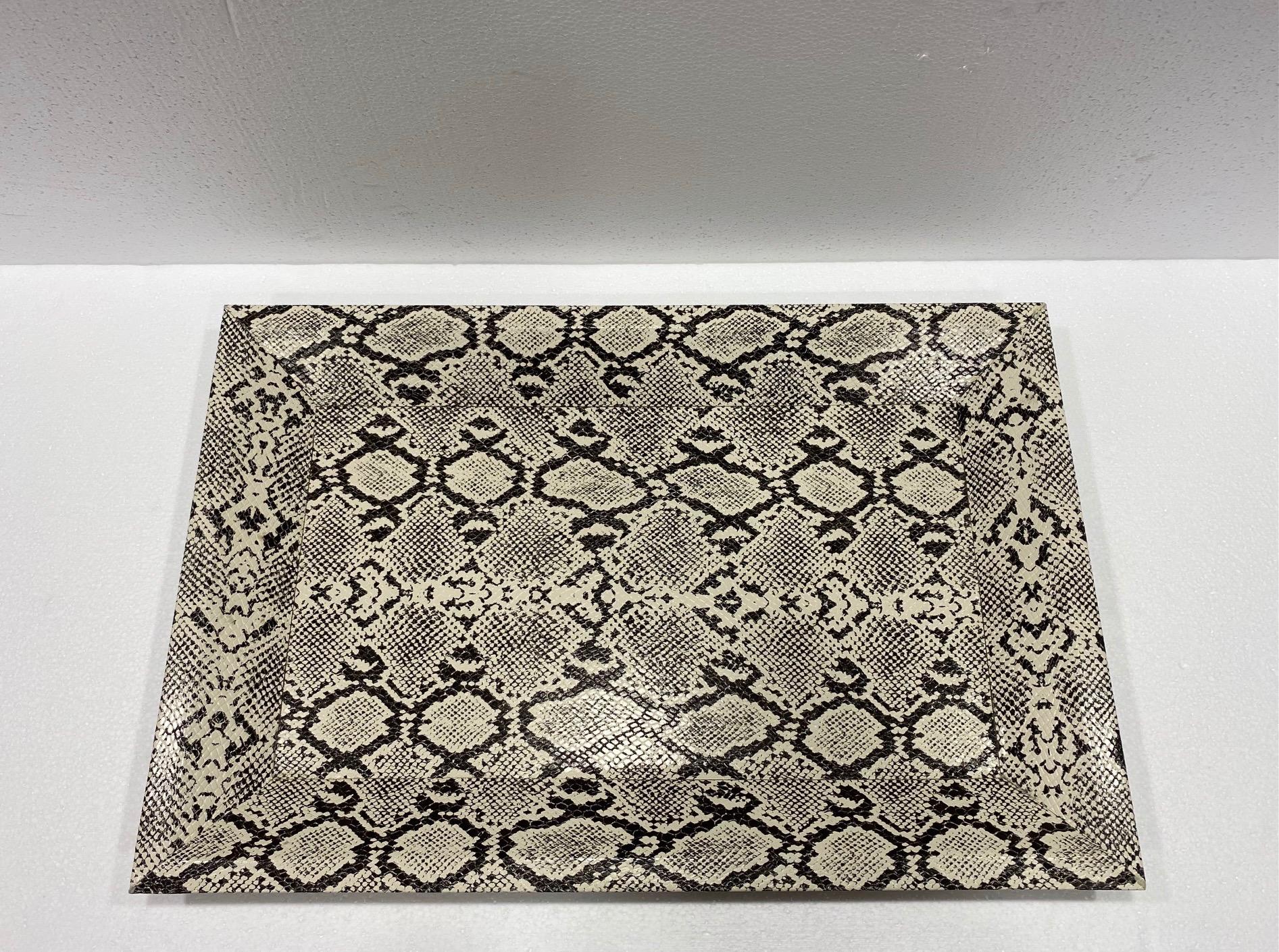 Mid-Century Modern style decorative tray with shadowbox design. Handcrafted with wood frame wrapped in faux leather and embossed python print in hues of black and cream. Makes a great coffee table accessory and a great addition to any barware set.