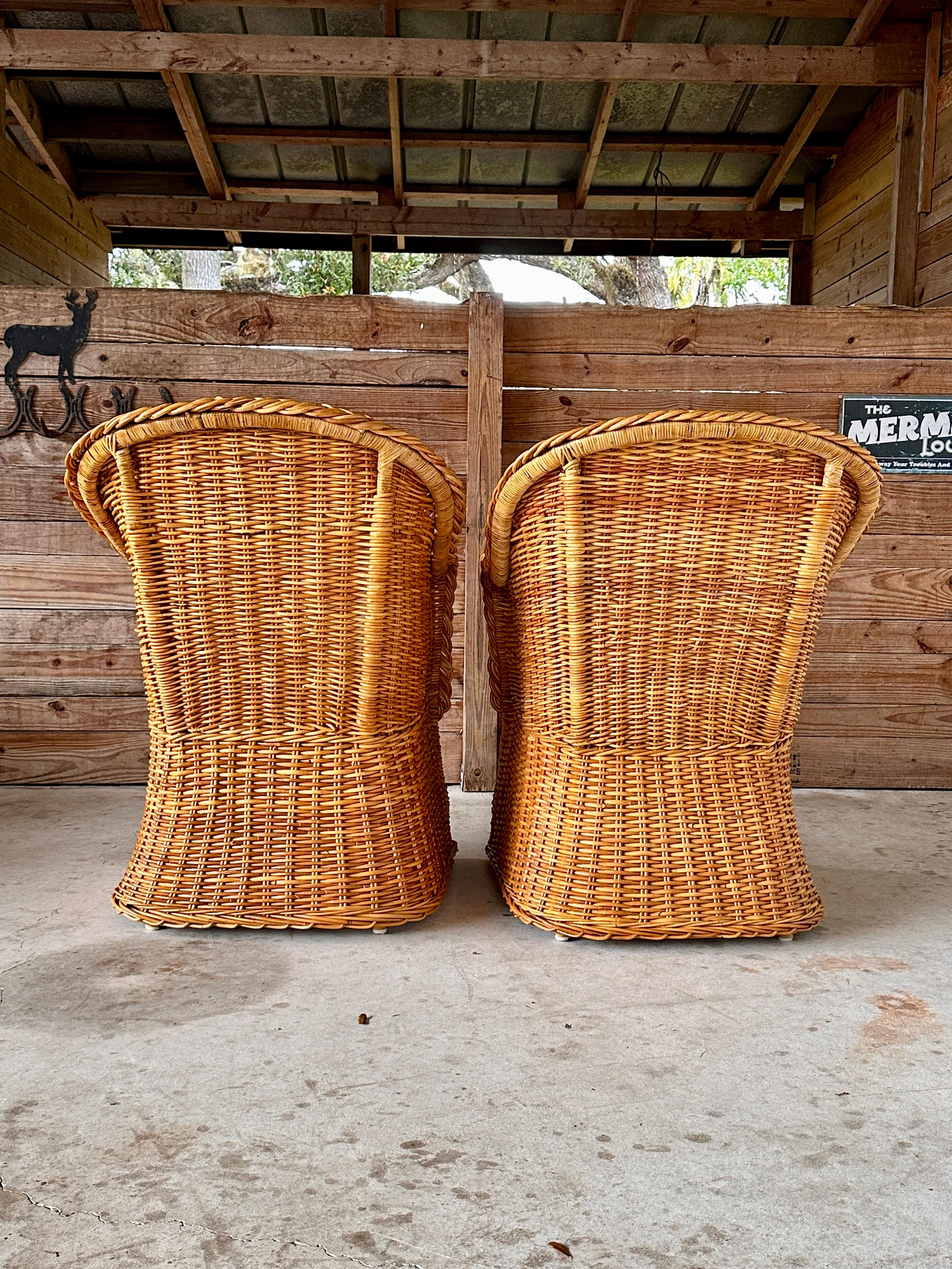 Pair of 1980s vintage rattan braid armchairs designed by Michael Taylor for Wicker Works, epitomizing the timeless organic modern aesthetic.
These chairs feature a beautifully woven braid detail and a sturdy rattan construction, making them perfect