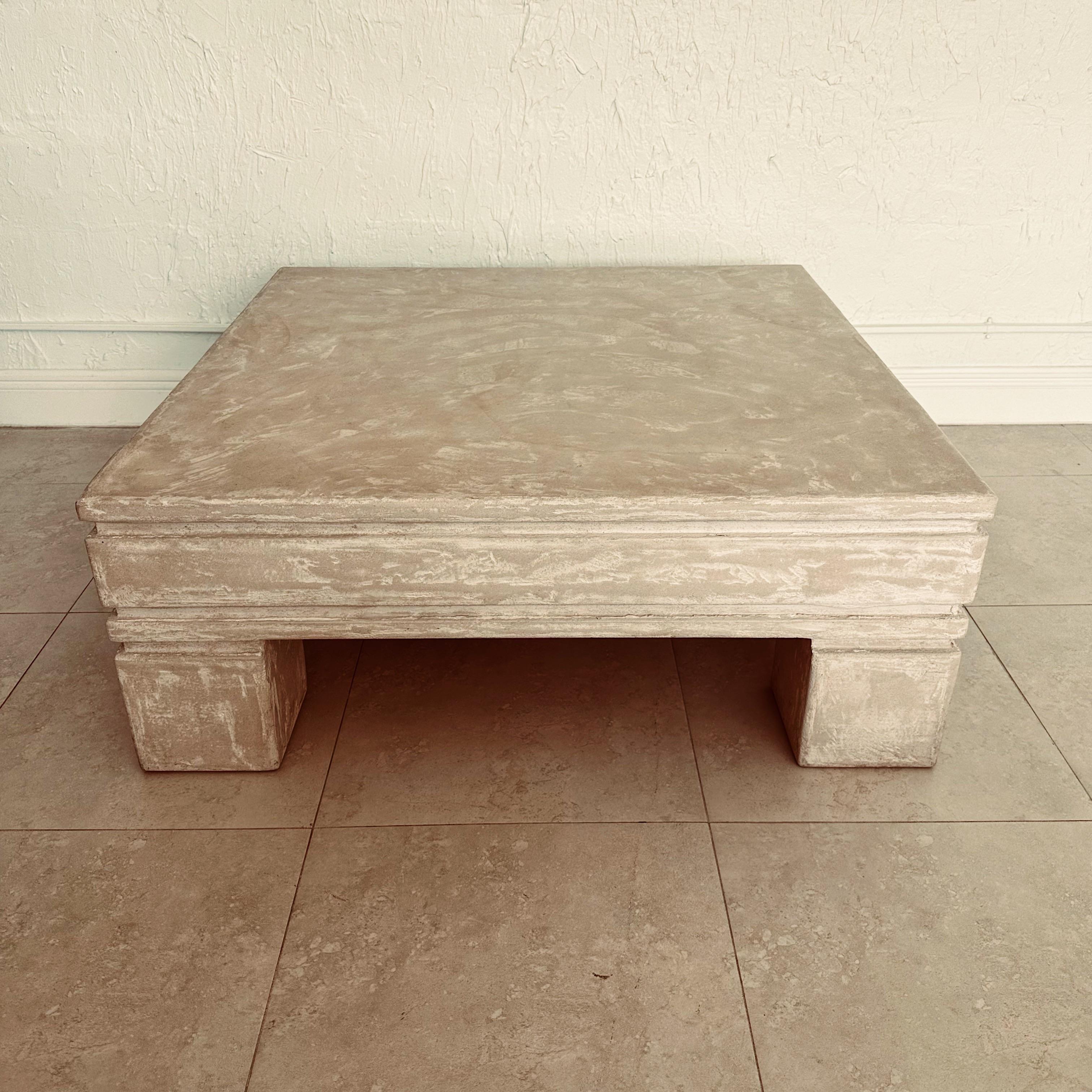 Vintage four legged organic square coffee table with textured plaster over wood from the 1980's. In the style of Michael Taylor. Unsigned.