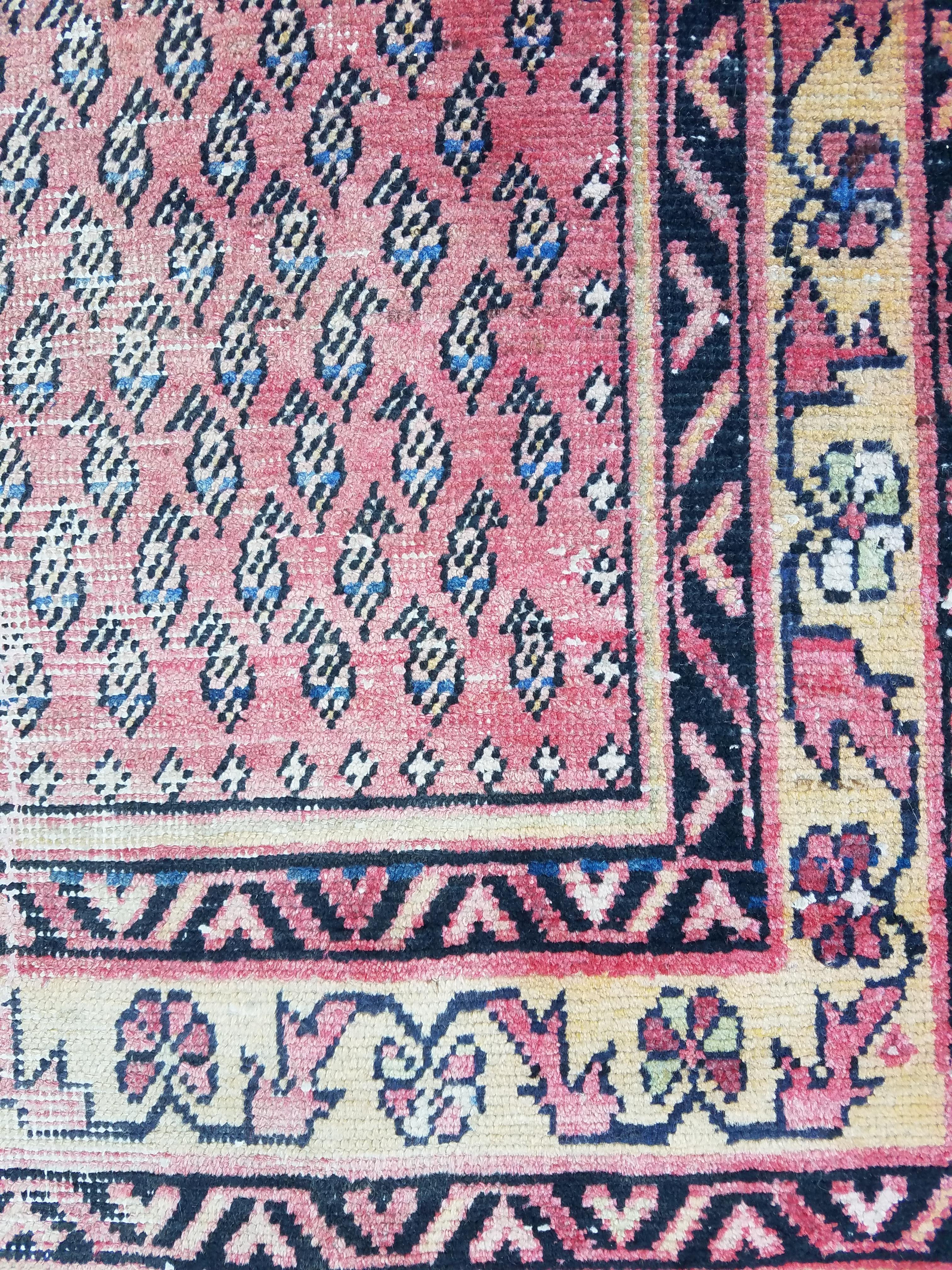 What an amazing oriental rug this one is! This vintage carpet measures approximately 67