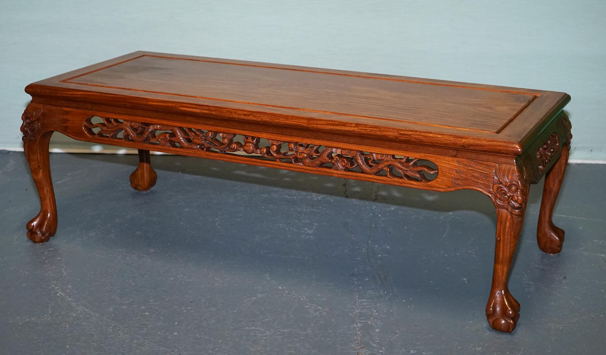 
Antiques of London



An exquisite vintage Chinese coffee table featuring intricate hand-carved detailing in solid wood. The apron showcases highly detailed pierced carvings of traditional Chinese dragons and cloud motifs, symbolising power,