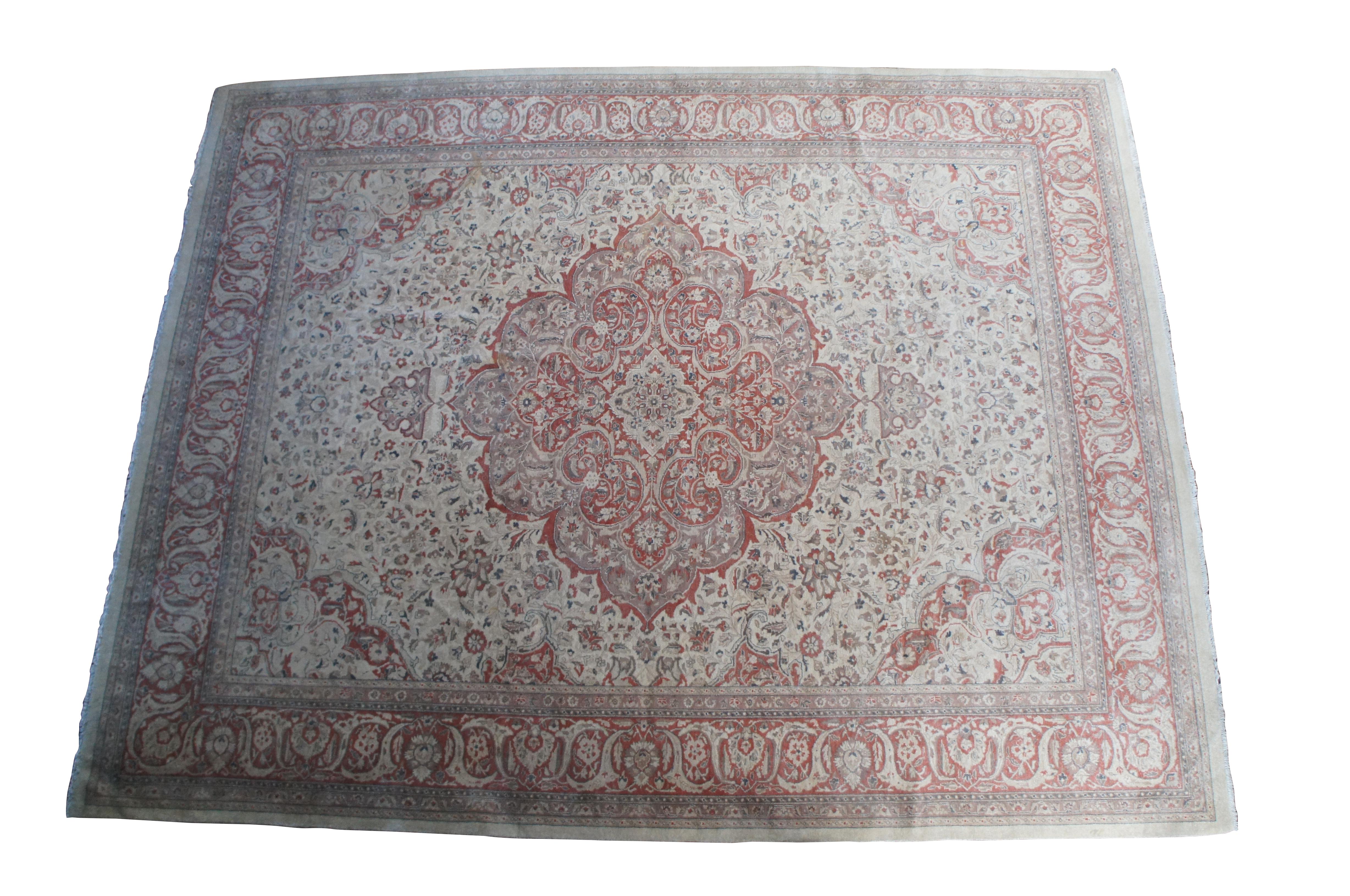 A very large traditional area rug, carpet or mat.  Made of wool featuring a floral all over design with large central medallion.  Blues, pinks, grey / tan  / beige, olive green.

Dimensions:
110
