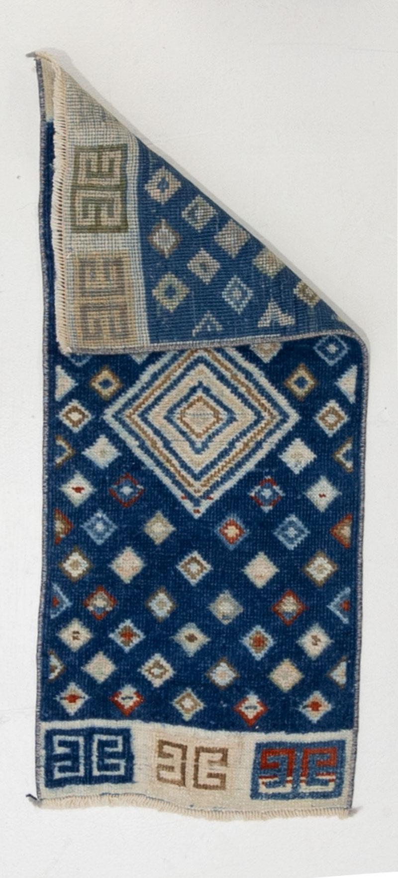 Age: Circa 1950

Colors: blue, tan, cream

Pile: low-medium 

Wear Notes: 0

Material: Wool on cotton. 

Beautifully saturated midcentury Anatolian yastik. 

Vintage rugs are made by hand over the course of months, sometimes years. Their