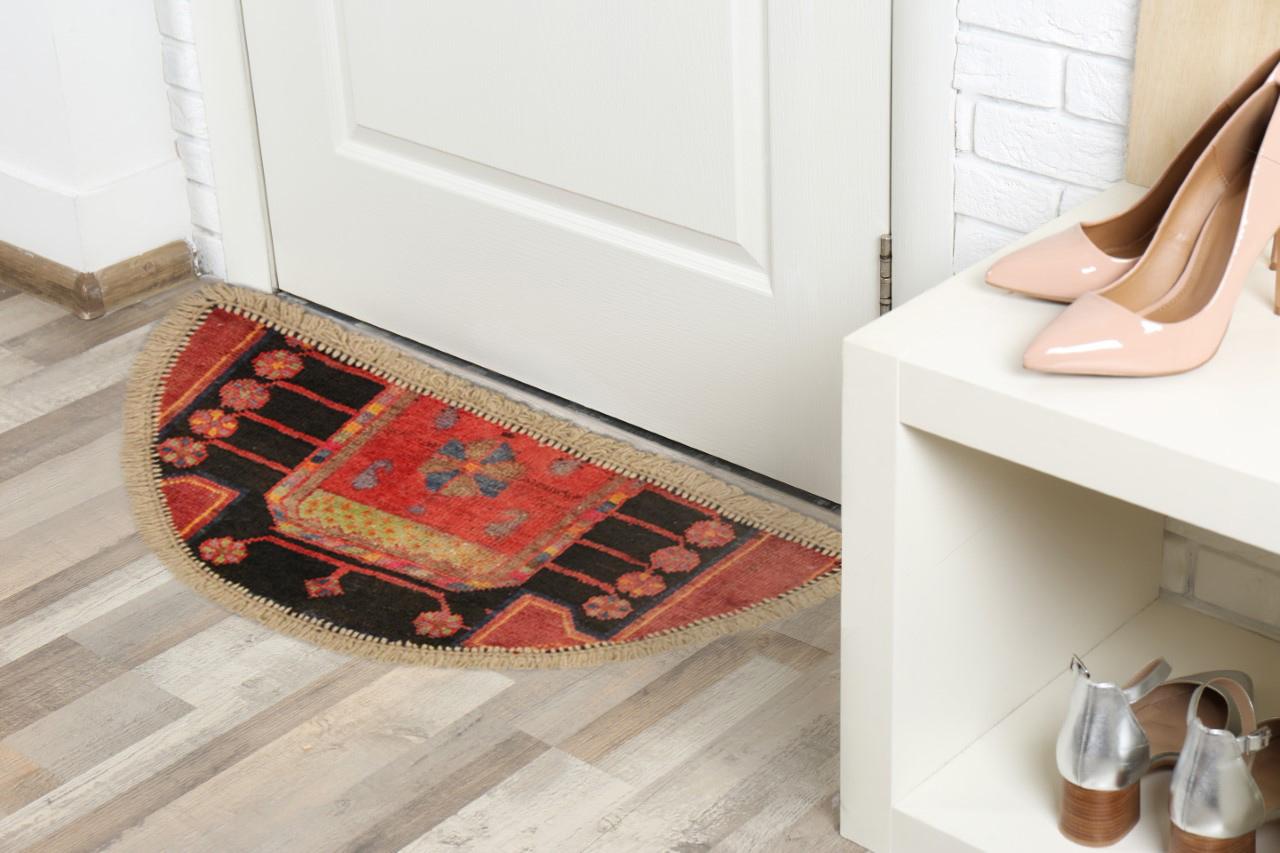 A vibrant pink has been used in the creation of this geometric handwoven rug, featuring asymmetrical geometric motif on deep blue background. Perfect for any modern or traditional interior. This semi-circle entranceway doormat has been refurbished