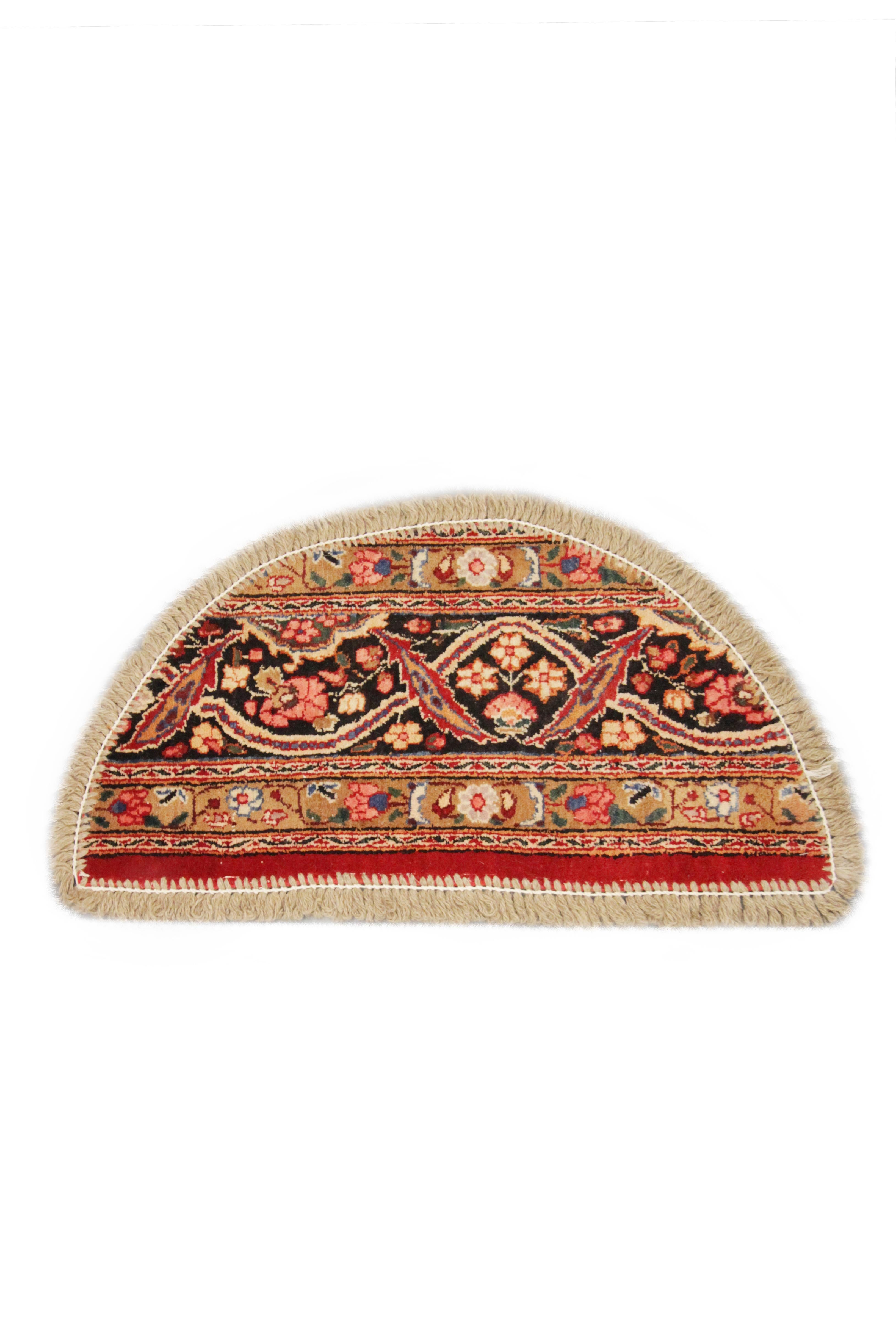 This handmade carpet high-quality doormat features a multilayered floral pattern with a mixture of contrasting and harmonious colorways. Perfect for any traditional or modern interior. This semi-circle entranceway doormat has been refurbished from a