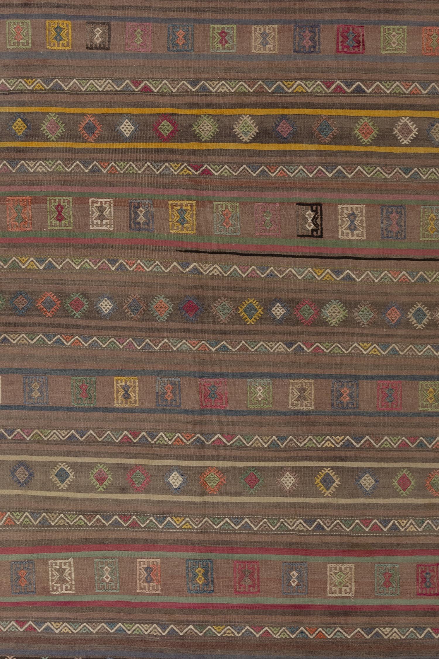 Age: Circa 1950

Colors: Brown, Yellow, Red, Pink, Green

Pile: low

Wear Notes: 5

Material: Wool on cotton

Wear Guide:
Vintage and antique rugs are by nature, pre-loved and may show evidence of their past. There are varying degrees of