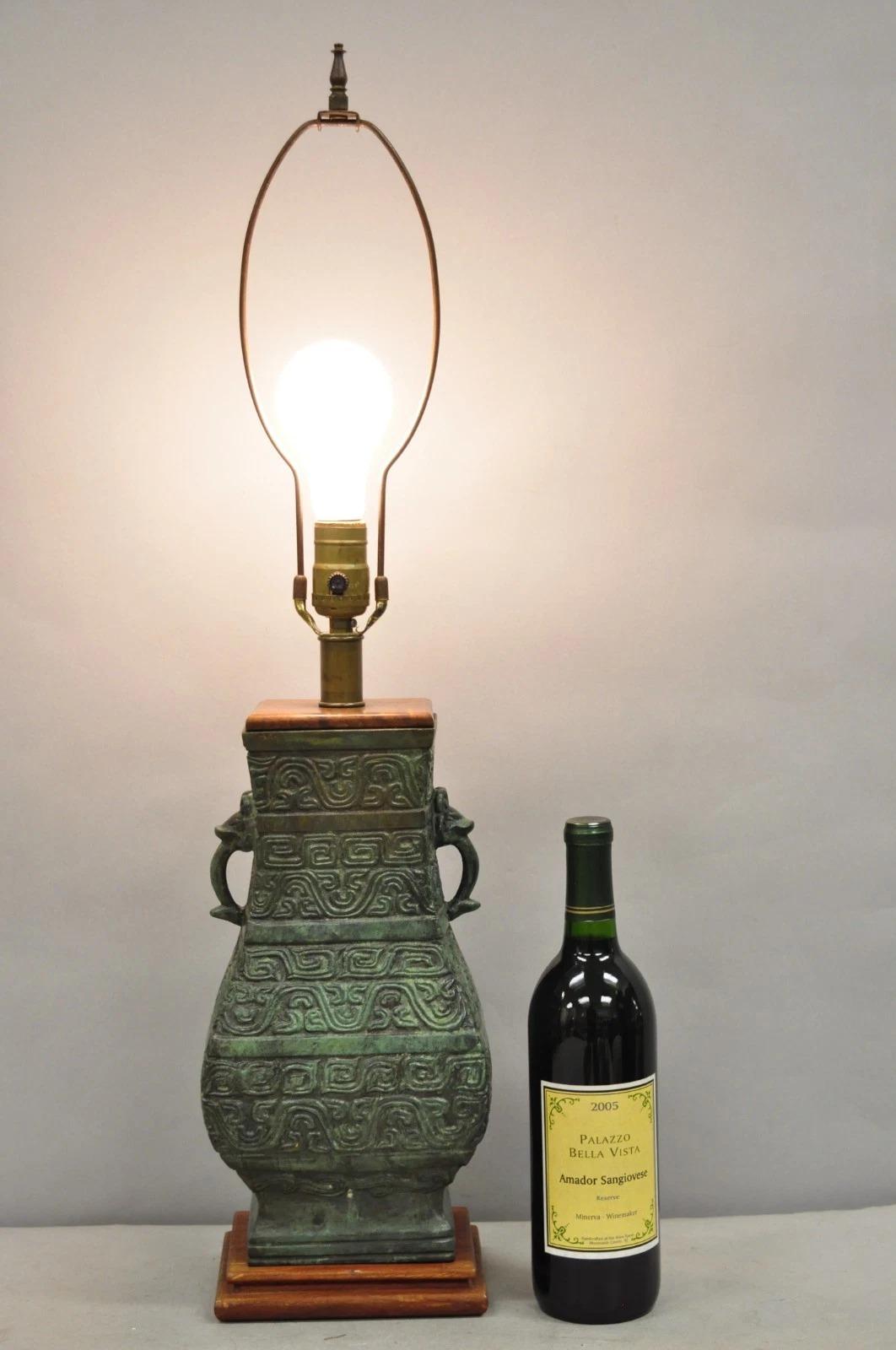 Vintage Oriental Verdigris Green Heavy Archaic Bronze Figural Chinese Table Lamp with Solid Wood Mounts. Circa Mid 20th Century. Measurements: 29.5