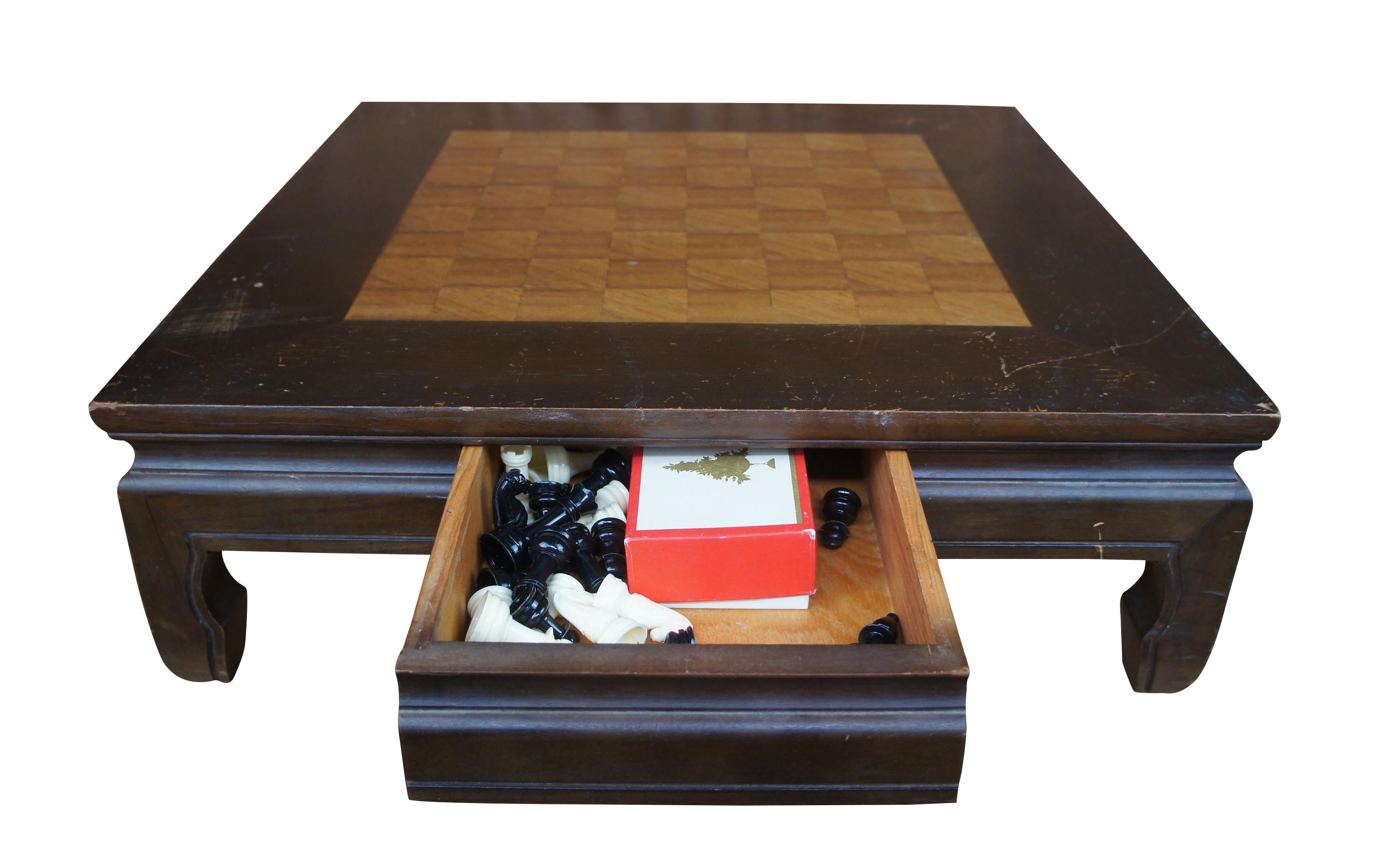 A handmade kiln dried hardwood tabletop chess board with ming styling featuring a sliding drawer that holds plastic chess and checkers pieces. Made in Keelung Taiwan by Oriental Woodcraft LTD.

Measures: board- 24