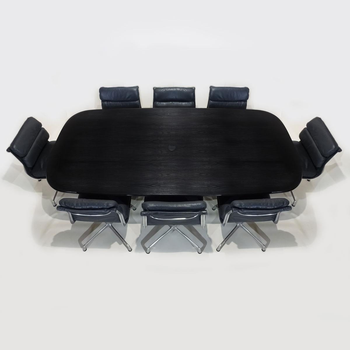 An exceptional vintage Charles and Ray Eames Boardroom table and chair set with original Vitra table and 8 dark grey leather Herman Miller soft pad chairs.

Dating from the mid-1980s this is a truly rare and beautiful example of a complete