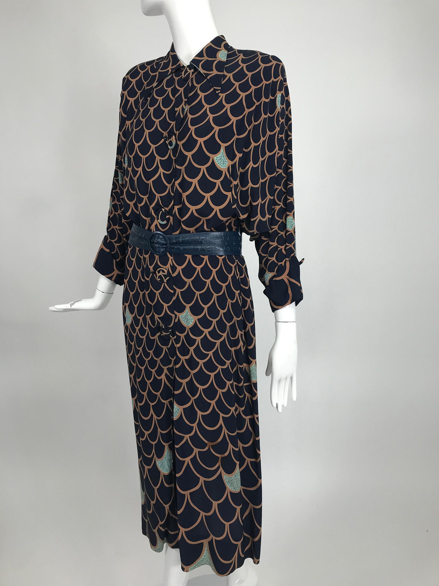 Vintage, Original Franklin Fashions Chicago, rayon print day dress from the 1940s. The print of this dress is very interesting, like fish scales, this print graduates from small to large, light brown and dark blue, with scattered turquoise 