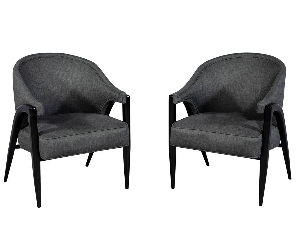 Vintage original Mid-Century Modern pair of club chairs. Featuring sleek curved backs with curved legs recently upholstered in Maxwell – Bowery ESS #801 charcoal. Finished in a rich satin black lacquer.