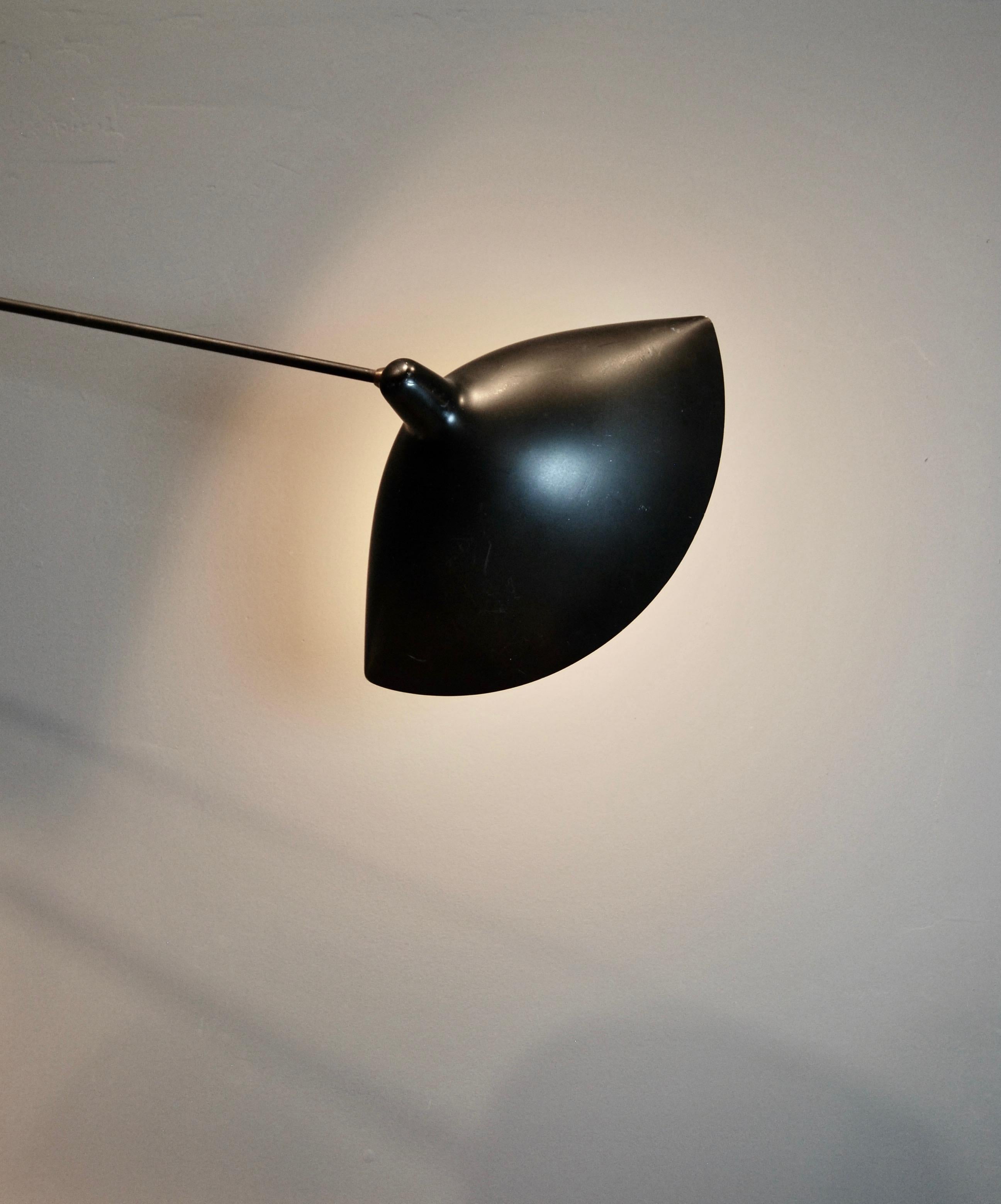 Rare, original Serge Mouille angled wall lamp with two pivoting arms. 