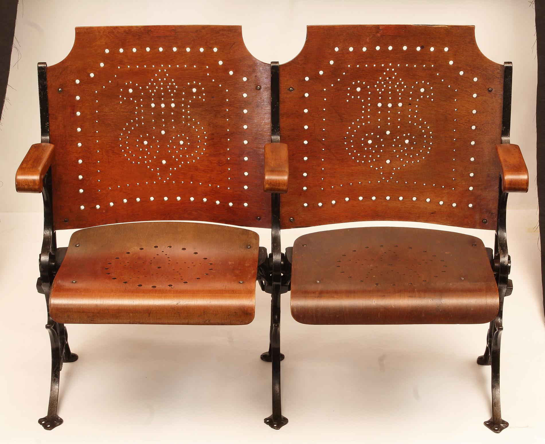Original vintage steel and wood folding theatre seating, seats/chairs. Available in any configuration from one to ten. This is a set of two.
Item pictured is an example. Because these are vintage, there are minor variances. Images of available