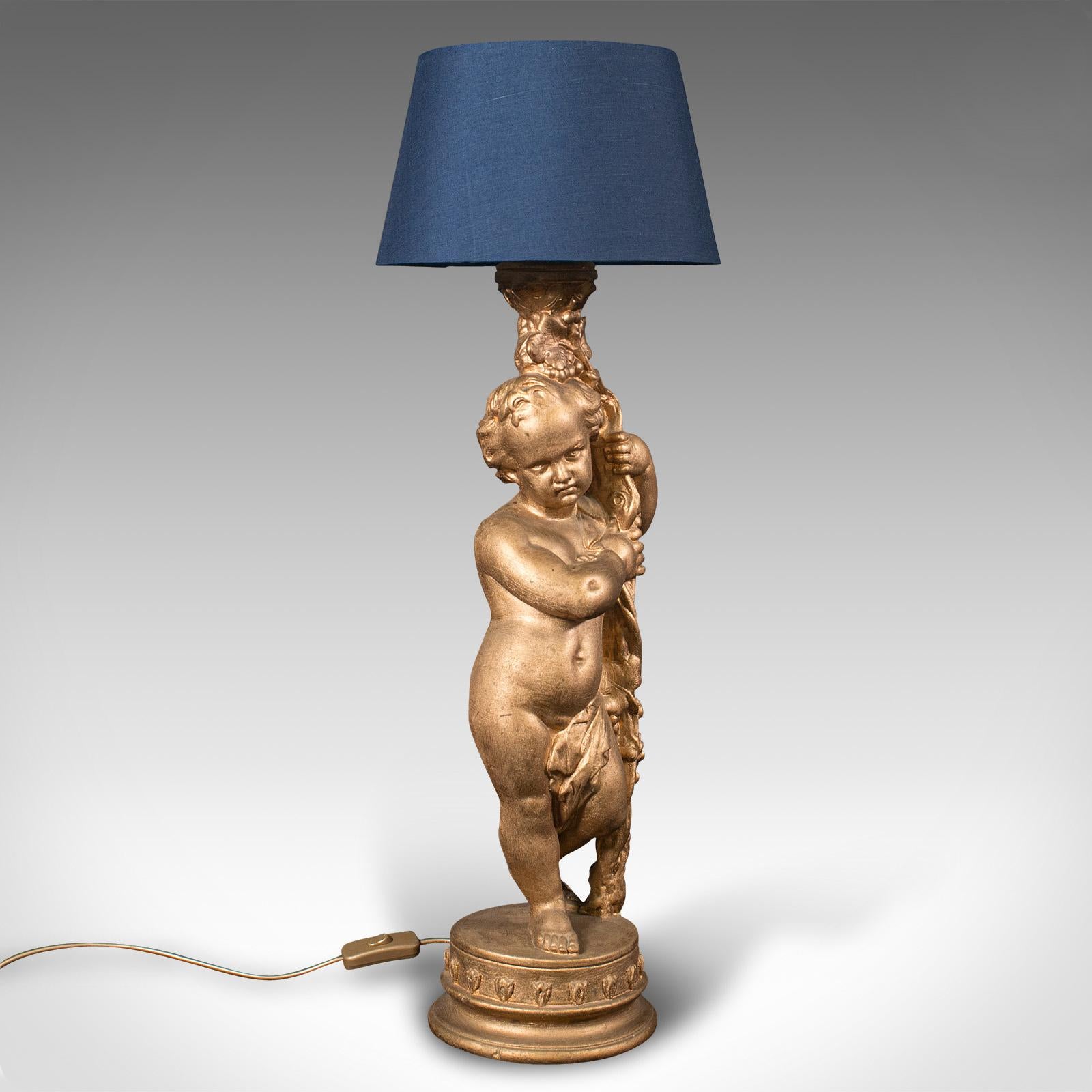 This is a vintage ornamental putto lamp. An English, plaster decorative cherub table light, dating to the late 20th century, circa 1970.

Exquisite tonality with classical Italianate taste
Displays a desirable aged patina and in good