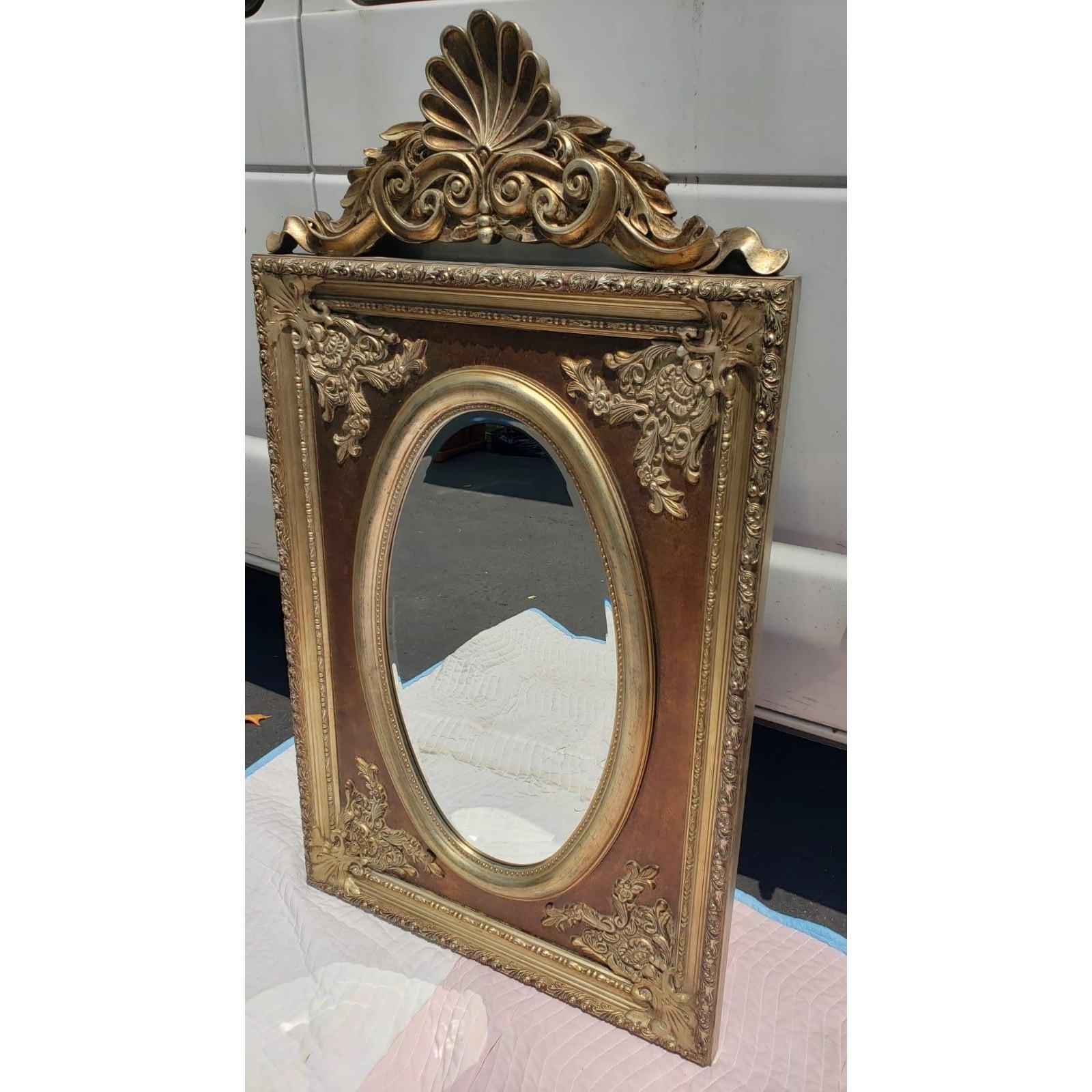 Ornate Beveled wall mirror. 
exceptionally beautiful and very decorative mirror.
Attributed to the Bradburn Gallery.
Mirror measures 28