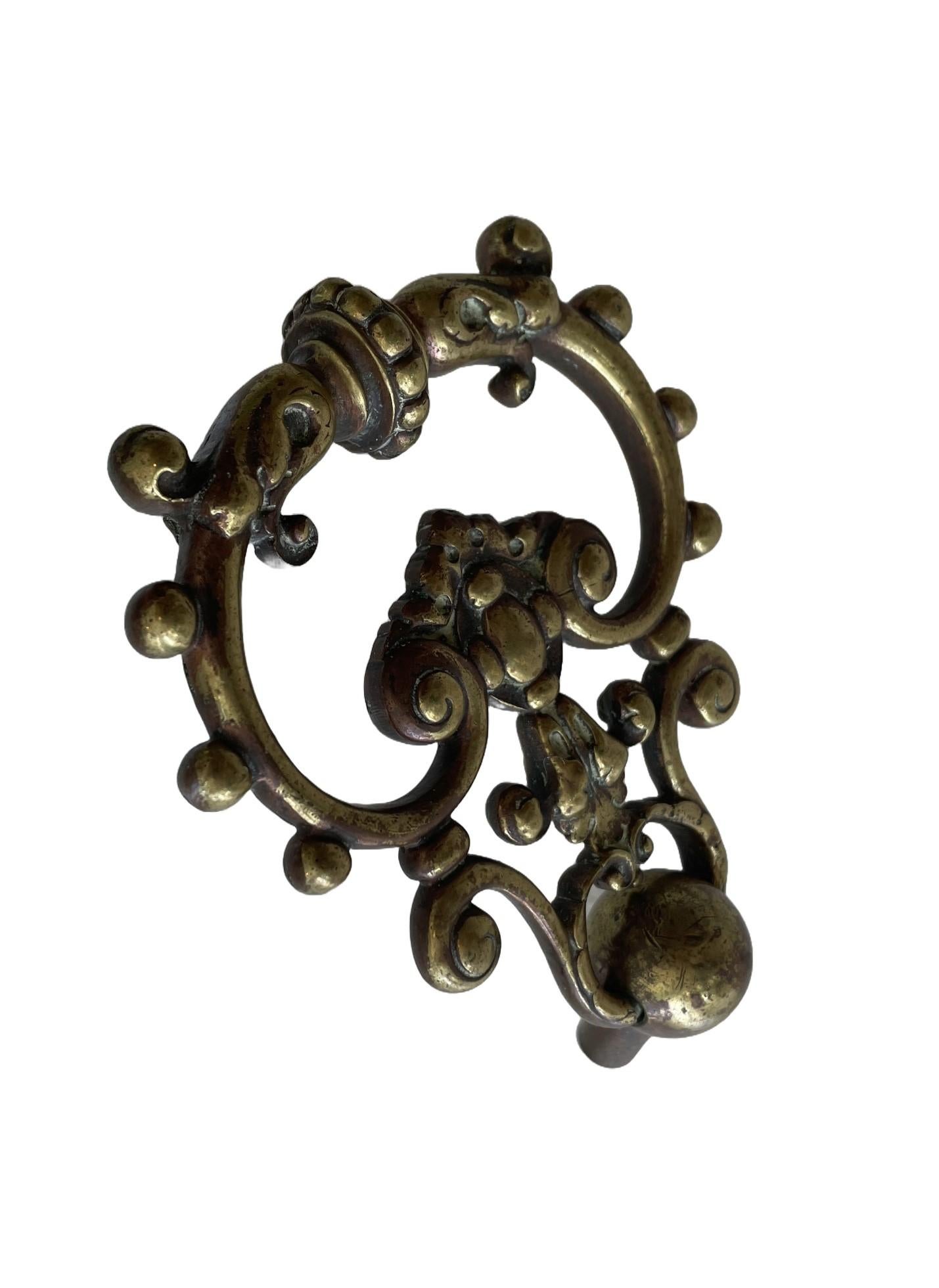 A beautifully ornate vintage bronze door knocker in solid bronze. Whether for a new or historical home, this unique threshold object speaks volumes about the home within.
