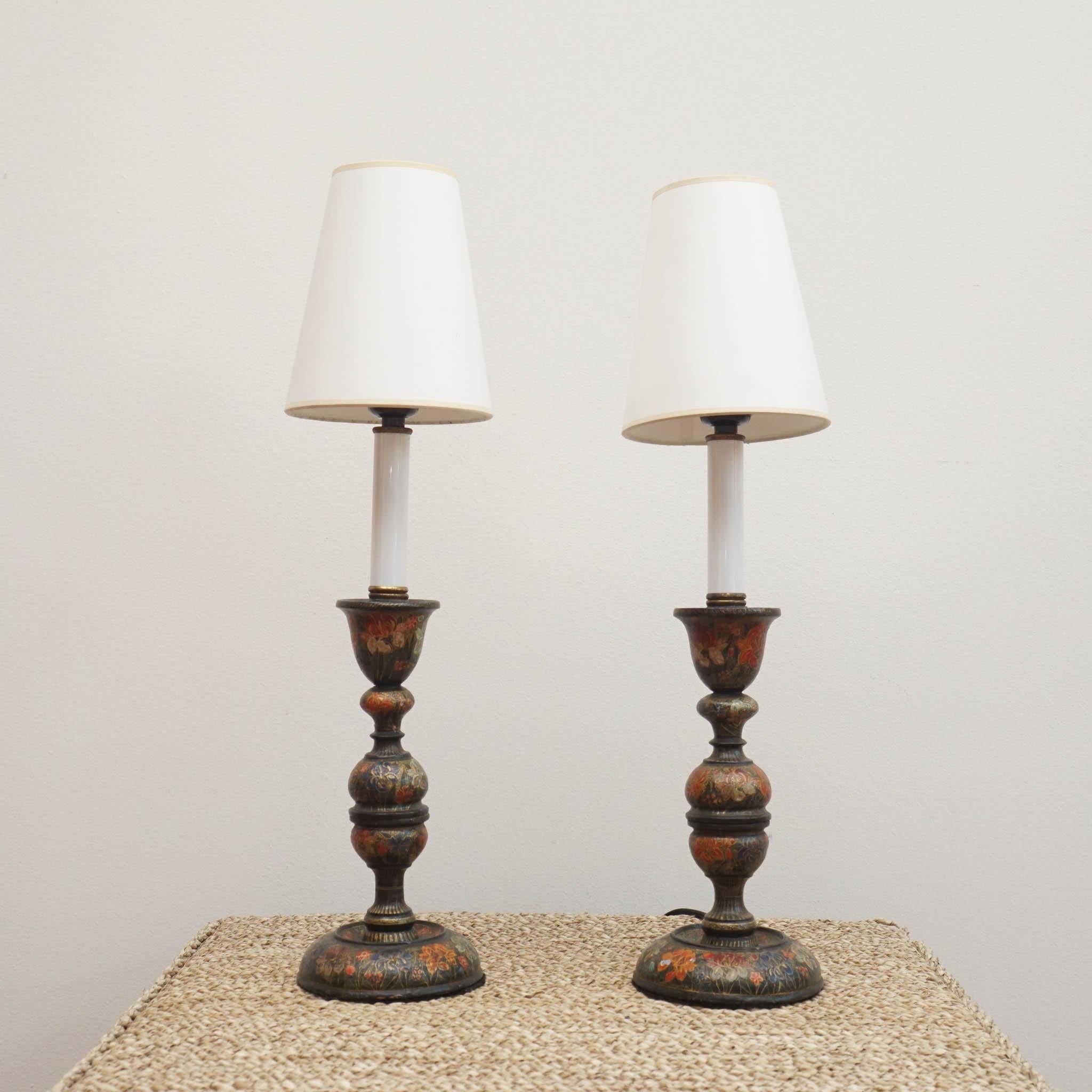 These vintage French candlesticks have been brilliantly repurposed into quaint table lamps. With delicately painted floral motifs, these lamps are fully functional. Ideal for creating a moody ambiance, they make a stunning and unique addition to