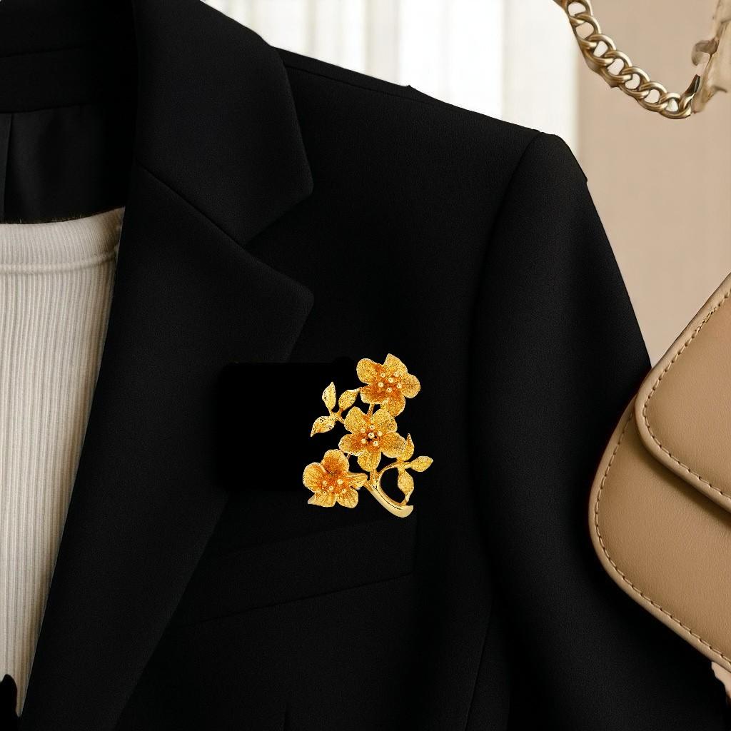 
The Yellow Gold Ornate Triple Floral Design Vintage Brooch is a stunning piece of jewelry that features a unique and intricate design, an ornate triple carved floral design. The brooch is made from 14 karat yellow gold, which is a durable and