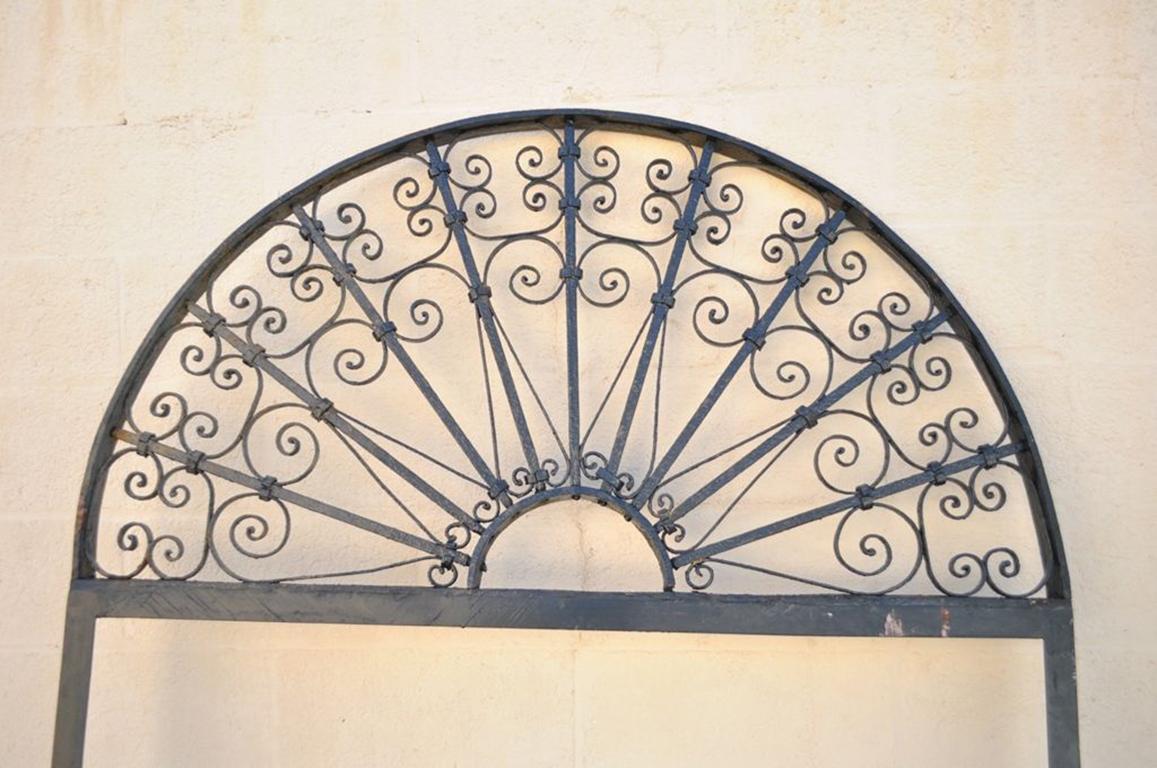 Quality, vintage, wrought iron scrolling decorative door arch. Item features a handmade frame, with ornate scrolling detail on the arch and very attractive overall form. Please be sure to check measurements to ensure item will suit your needs, circa