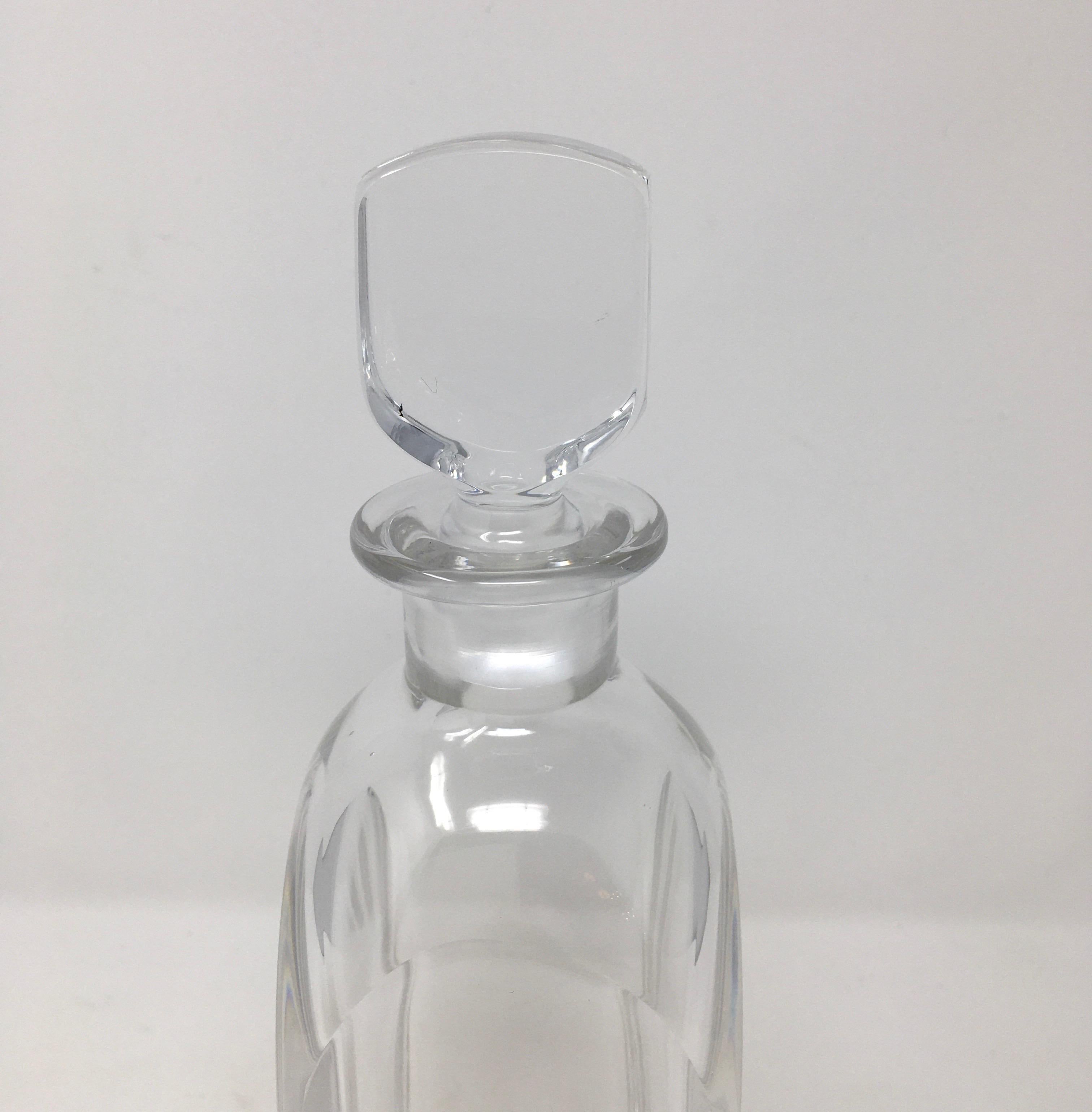 This is a 20th century crystal decanter with stopper. Made by Orrefors, Sweden. This beautiful decanter is ready for your bar or bar cart.

This piece weighs 4 lbs.