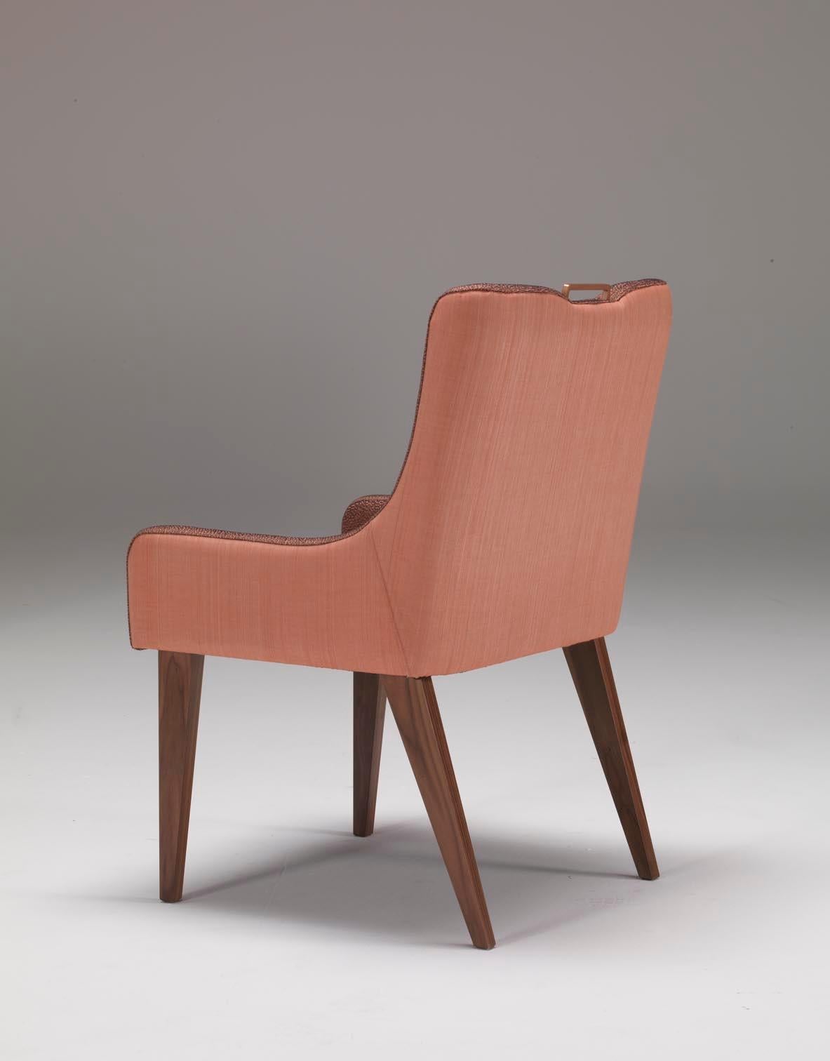 Perch - Dining chair in Black American Walnut matt finish, inside covered in Rubelli “Almoro” fabric range, colour Legno di Rosa, external back covered in horsehair, rose gold metal handle on back top.
cm. 55W*53D*87,5H.
 