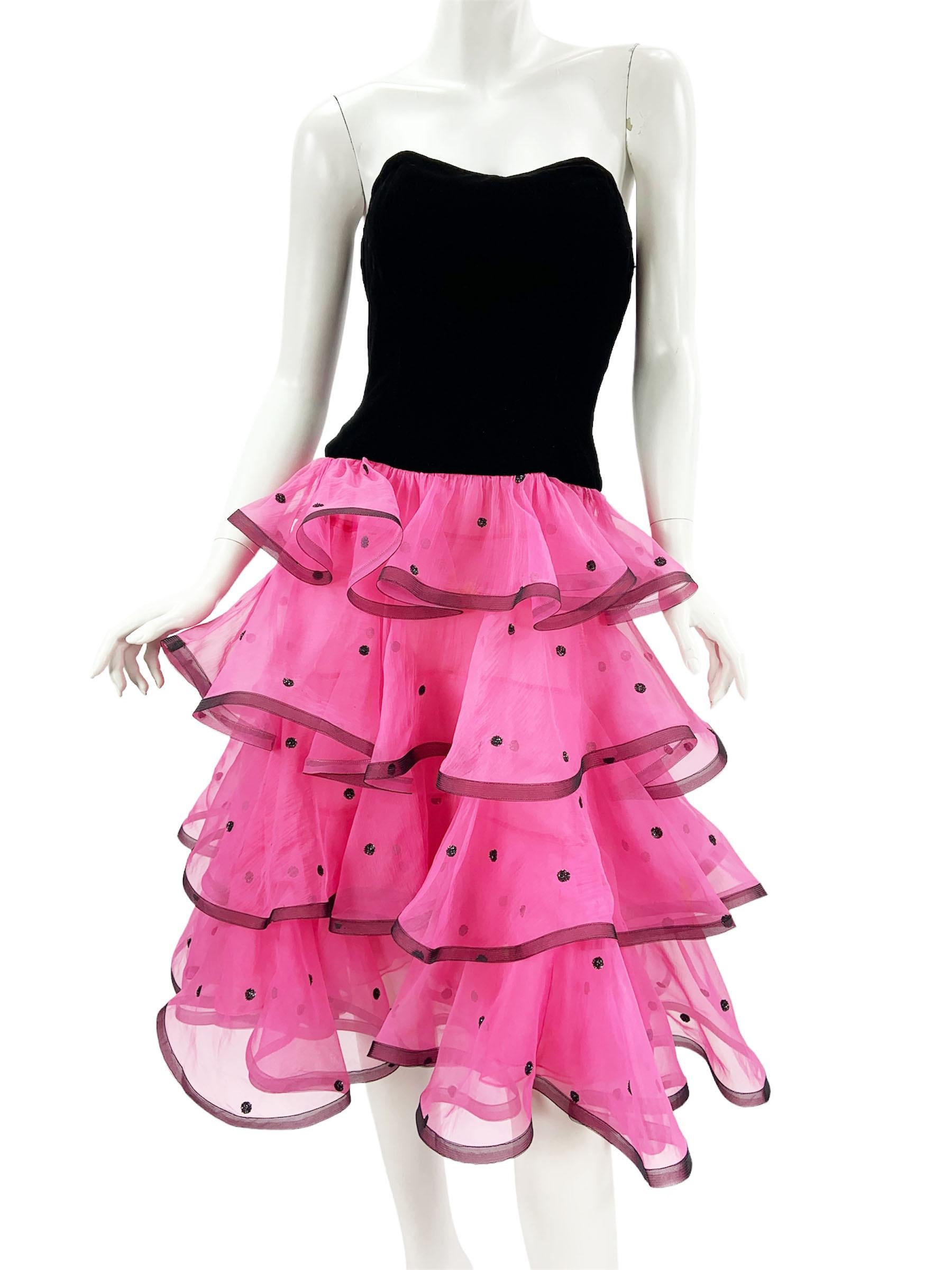 Vintage 80's Oscar de la Renta Cocktail Dress
US size - 8
Black Velvet Top with Corset, Lace Up Closure, Layered Pink Chiffon Skirt with Glitter Dots, Fully Lined, Back Zip Closure.
Measurements: Length - 35 inches ( under the arm and down), Bust -