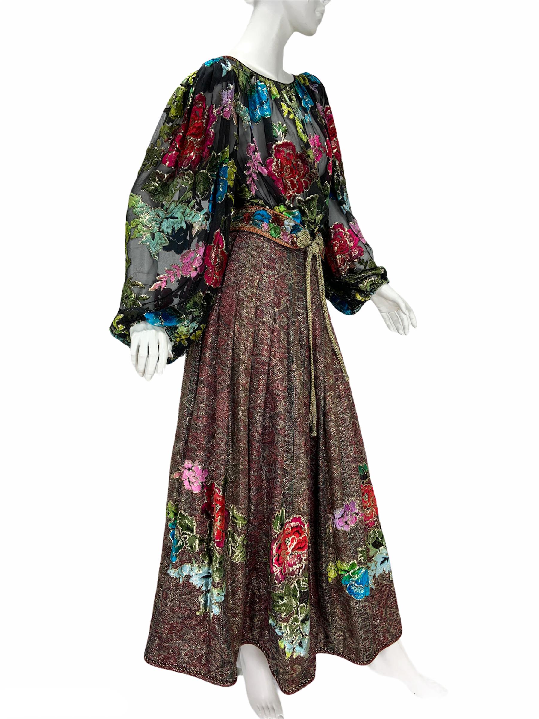 Vintage Oscar De La Renta for Neiman Marcus Skirt Suit with Belt
F/W 1984 Runway Collection
Designer size - US 8
Blouse - Black Sheer Silk with Multi-color Velvet & Lurex Flowers, Pleated for Oversize Look, Flowing Sleeves with Elasticized Wrists,