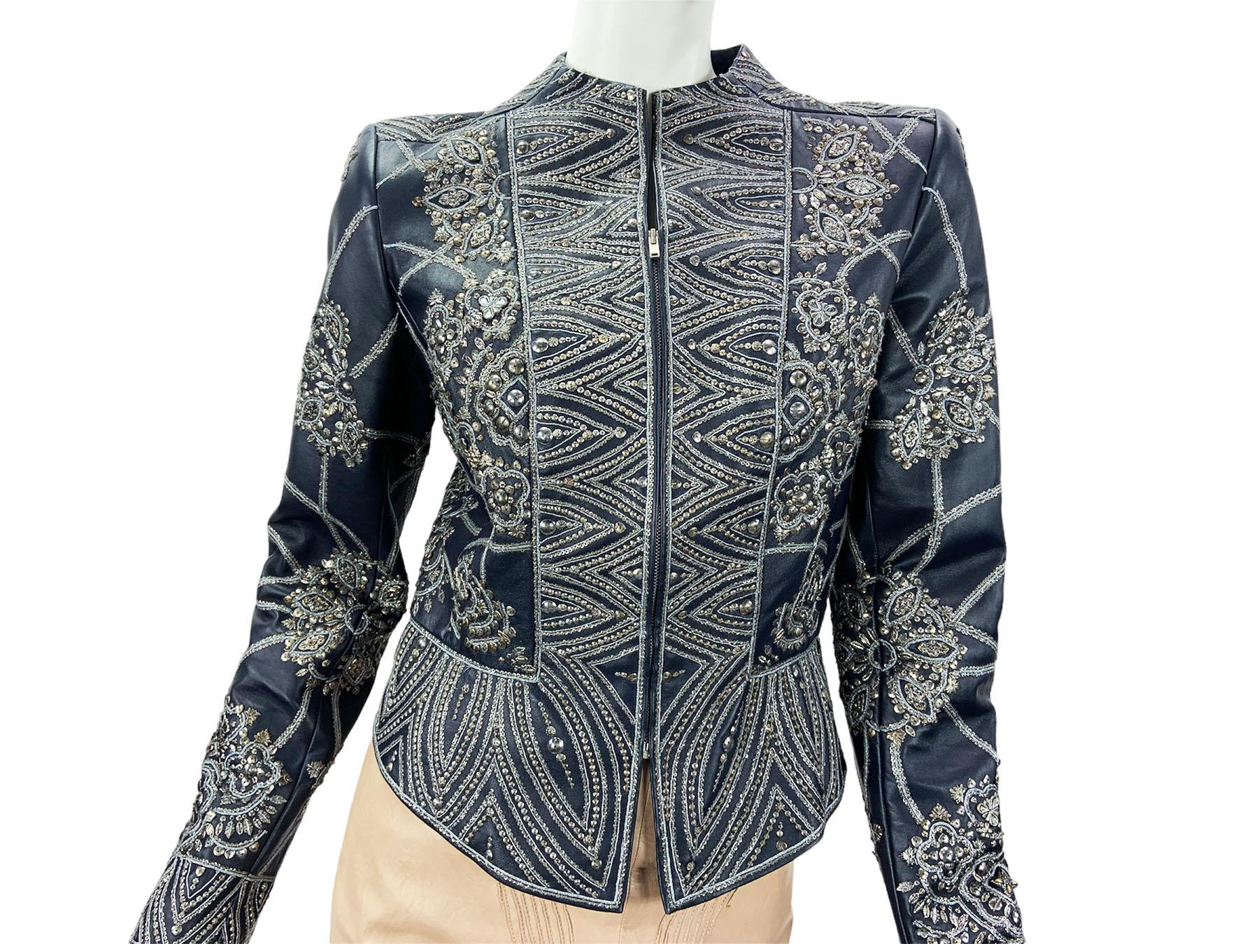 Vintage Oscar de la Renta  Blue Leather Embellished Jacket 
F/W 2006 Collection
US size - 6
Lamb Leather, Exclusive Embroidery in Silver Tone Metal Ornamental Decoration.
Peplum Style, Zip Closure, Fully Lined.
Measurements: Length - 22 inches front